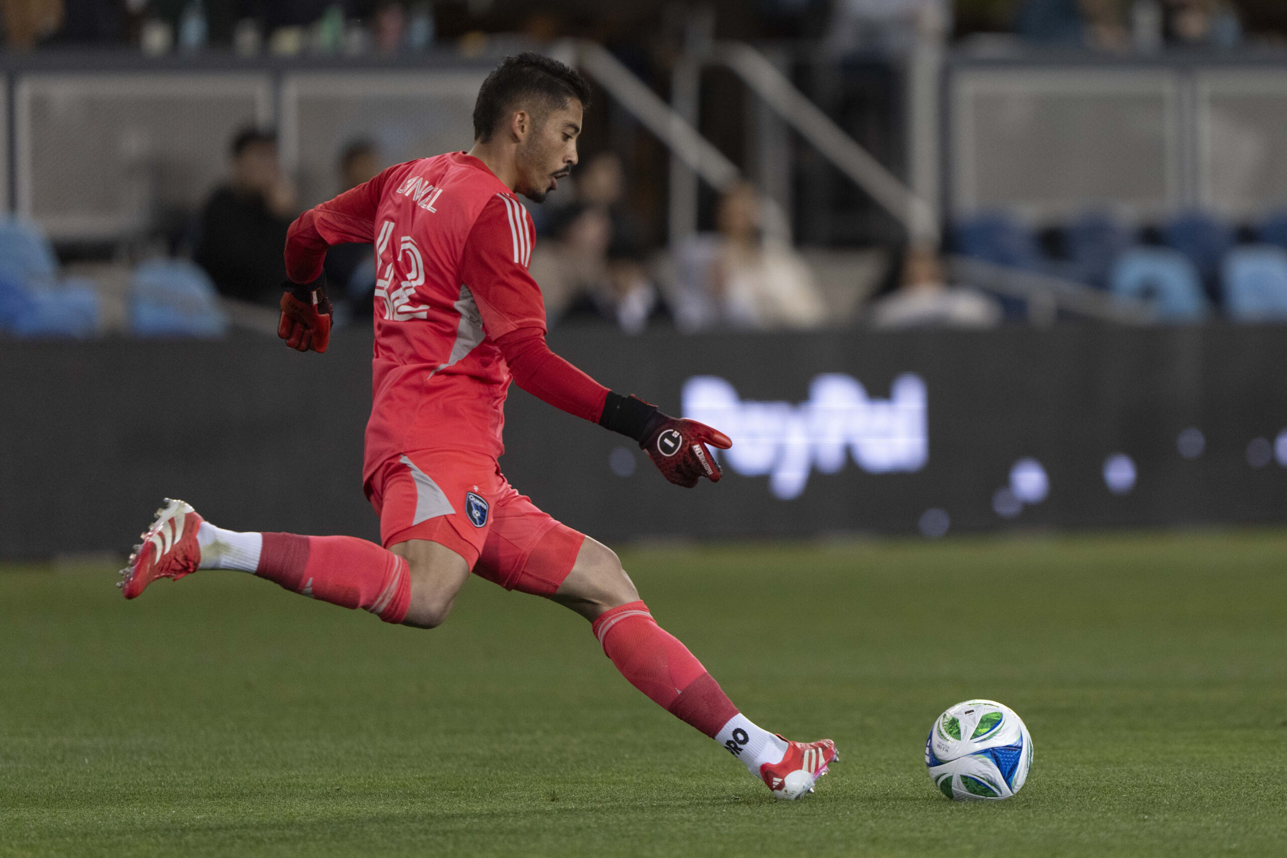 Mar 29, 2025; San Jose, California, USA;  San Jose Earthquakes goalkeeper Daniel (42) kicks the ball during the first half against the Seattle Sounders at PayPal Park. Mandatory Credit: Stan Szeto-Imagn Images