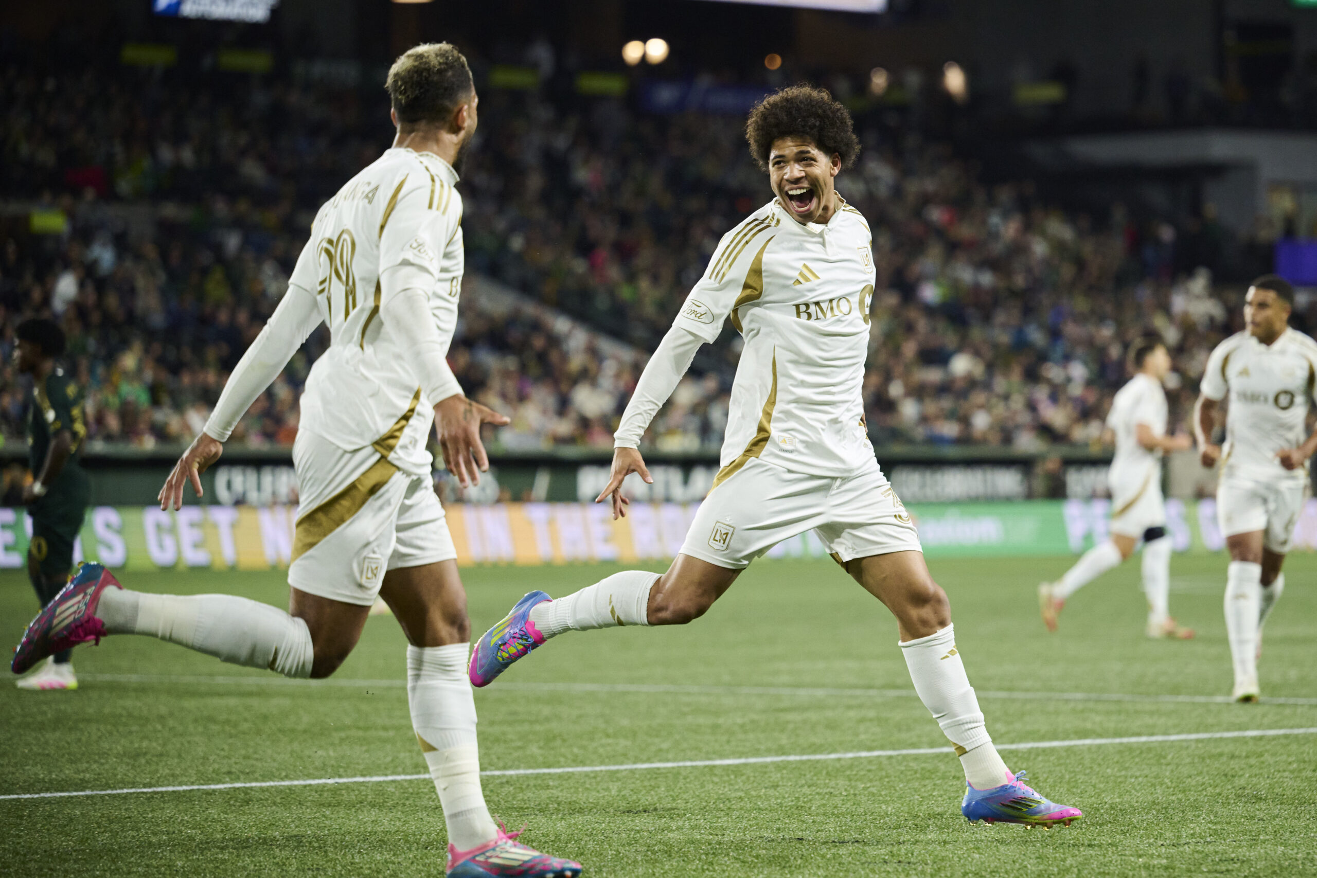 Apr 19, 2025; Portland, Oregon, USA; Los Angeles FC forward David Martinez (30) celebrates with Los Angeles FC forward Denis Bouanga (99) after scoring a goal during the second half against the Portland Timbers at Providence Park. Mandatory Credit: Troy Wayrynen-Imagn Images