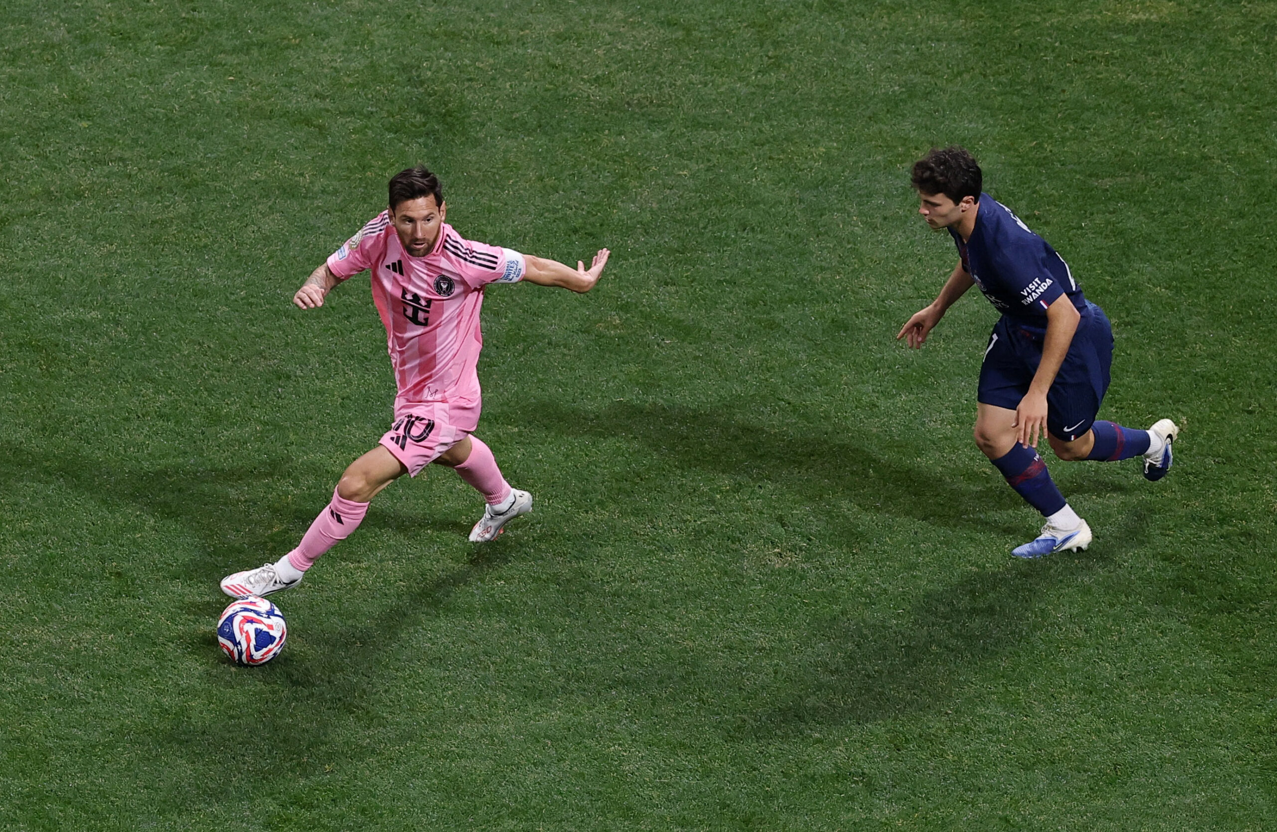 [Subscription Customers Only] Jun 29, 2025; Atlanta, Georgia, USA; Inter Miami FC forward Lionel Messi (10) kicks the ball past Paris Saint-Germain midfielder Fabian Ruiz (8) during a round of 16 match of the 2025 FIFA Club World Cup at Mercedes-Benz Stadium. Mandatory Credit: Amanda Perobelli-Reuters via Imagn Images