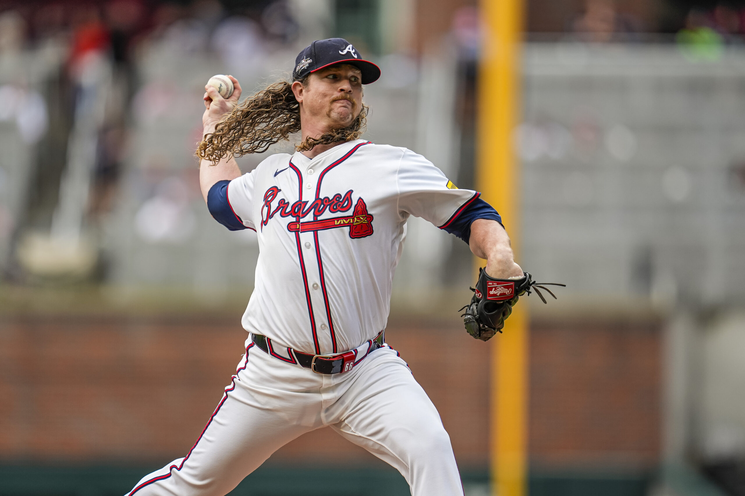 Jul 1, 2025; Cumberland, Georgia, USA; Atlanta Braves starting pitcher Grant Holmes (66) pitches against the Los Angeles Angels during the first inning at Truist Park. Mandatory Credit: Dale Zanine-Imagn Images