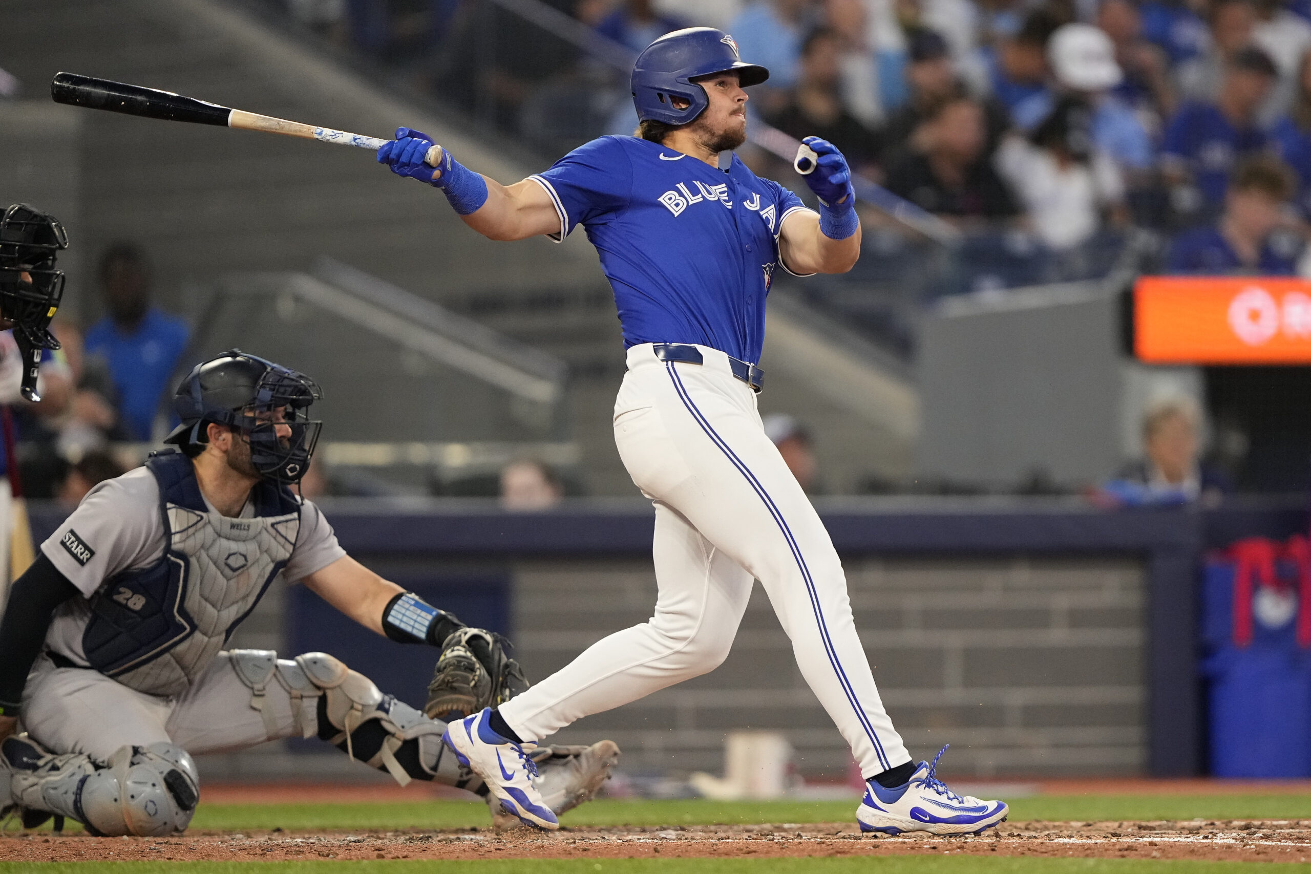 Jul 3, 2025; Toronto, Ontario, CAN; Toronto Blue Jays right fielder Addison Barger (47) hits a solo home run against the New York Yankees during the fifth inning at Rogers Centre. Mandatory Credit: John E. Sokolowski-Imagn Images