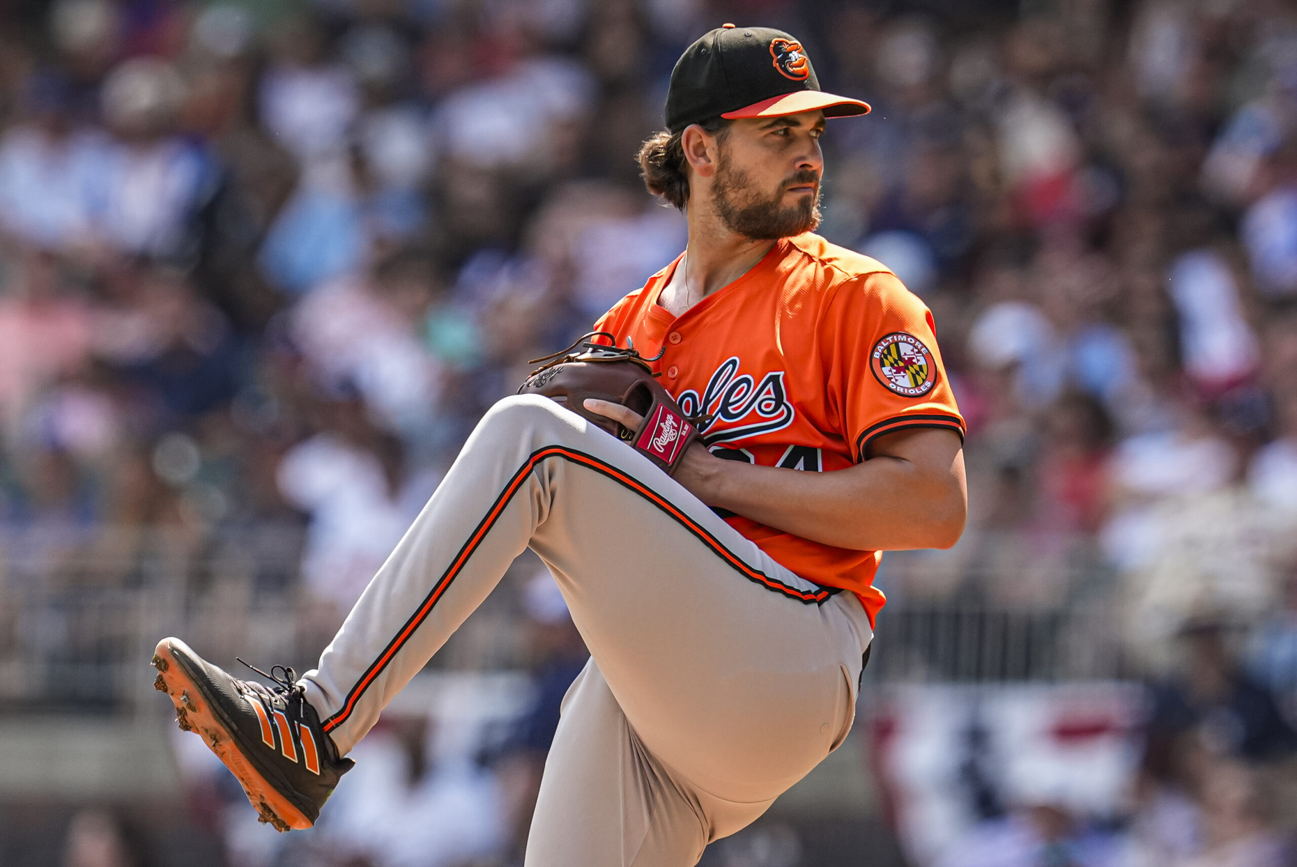 Jul 5, 2025; Cumberland, Georgia, USA; Baltimore Orioles starting pitcher Dean Kremer (64) pitches against the Atlanta Braves during the first inning at Truist Park. Mandatory Credit: Dale Zanine-Imagn Images