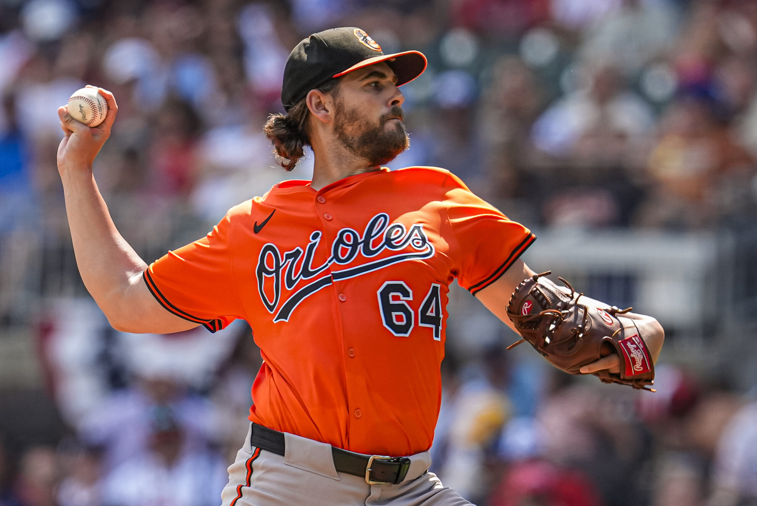 Jul 5, 2025; Cumberland, Georgia, USA; Baltimore Orioles starting pitcher Dean Kremer (64) pitches against the Atlanta Braves during the first inning at Truist Park. Mandatory Credit: Dale Zanine-Imagn Images