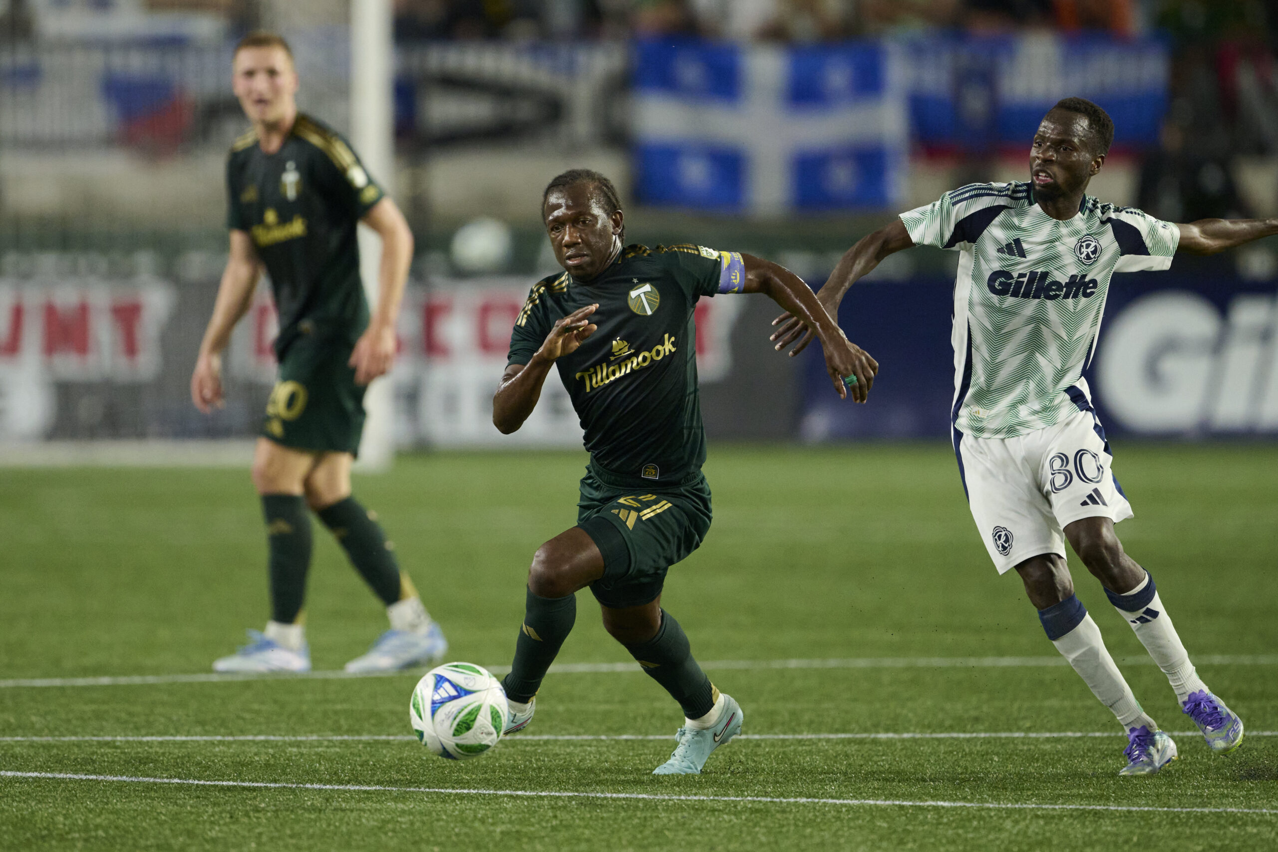 Jul 5, 2025; Portland, Oregon, USA; Portland Timbers midfielder Diego Chara (21) controls the ball during the second half against New England Revolution midfielder Alhassan Yusuf (80) at Providence Park. Mandatory Credit: Troy Wayrynen-Imagn Images
