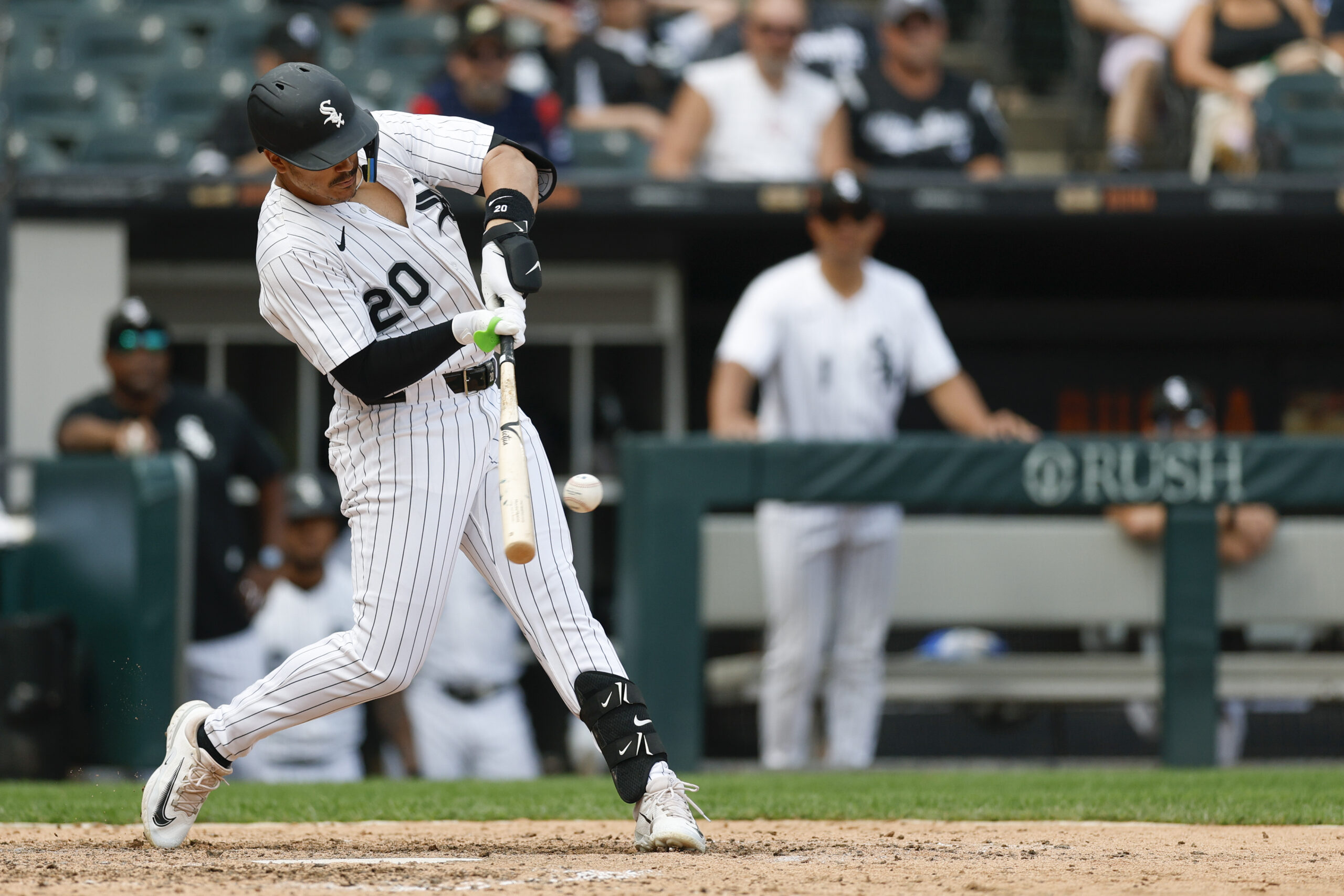 Jul 9, 2025; Chicago, Illinois, USA; Chicago White Sox third baseman Miguel Vargas (20) singles against the Toronto Blue Jays during the eight inning at Rate Field. Mandatory Credit: Kamil Krzaczynski-Imagn Images