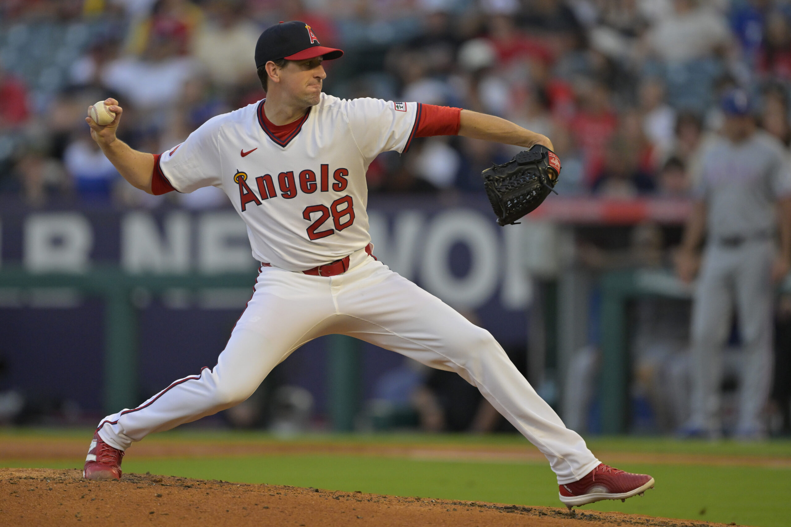Jul 9, 2025; Anaheim, California, USA;  Los Angeles Angels starting pitcher Kyle Hendricks (28) delivers in the fourth inning against the Texas Rangers at Angel Stadium. Mandatory Credit: Jayne Kamin-Oncea-Imagn Images