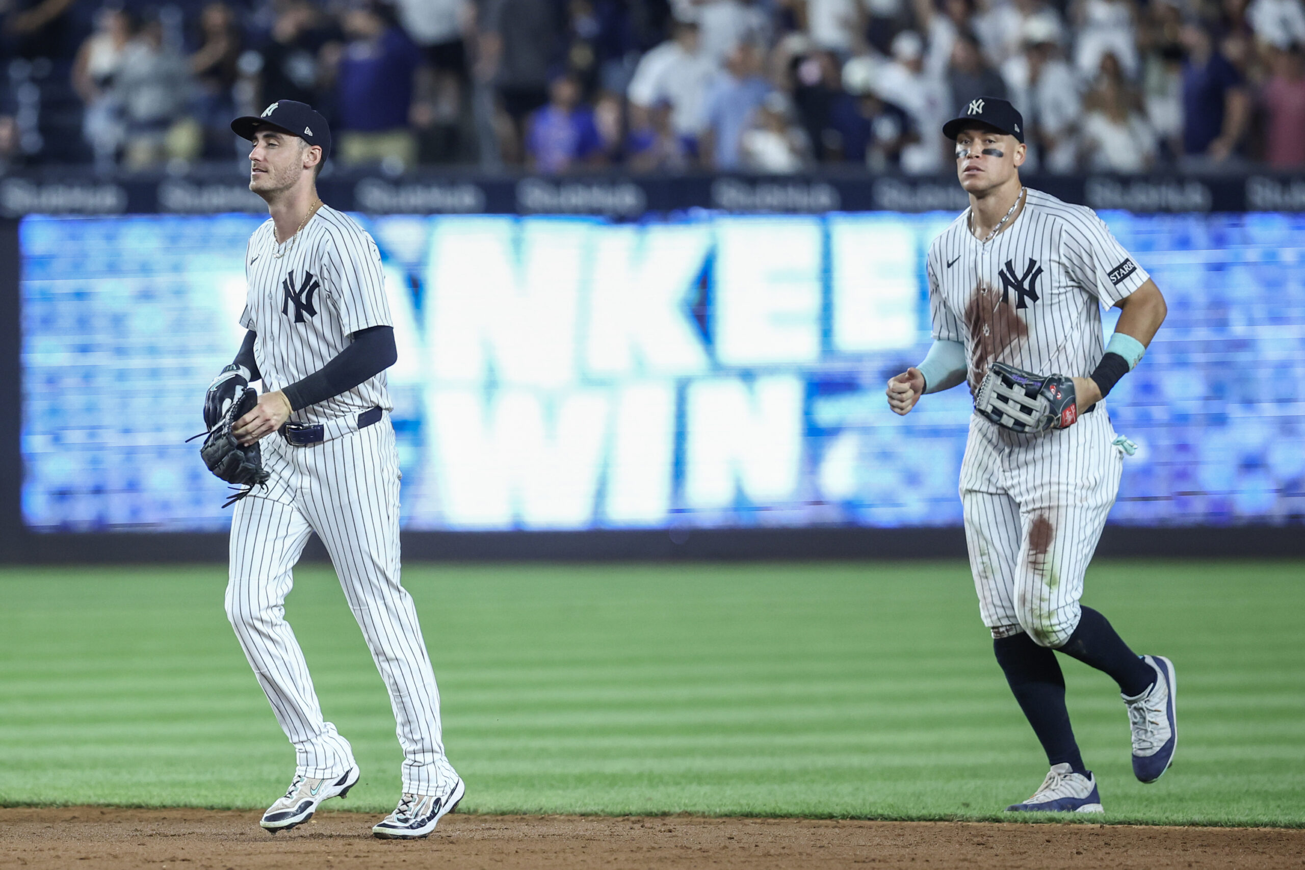 Jul 11, 2025; Bronx, New York, USA; New York Yankees center fielder Cody Bellinger (35) and right fielder Aaron Judge (99) walk off the field after defeating the Chicago Cubs 11-0 at Yankee Stadium. Mandatory Credit: Wendell Cruz-Imagn Images