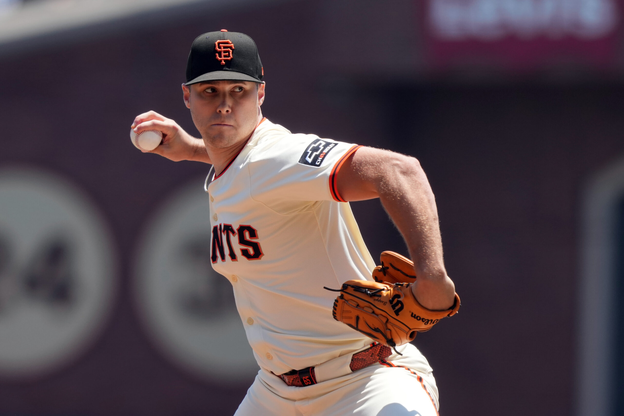 Jul 12, 2025; San Francisco, California, USA; San Francisco Giants starting pitcher Landen Roupp (65) throws a pitch against the Los Angeles Dodgers during the first inning at Oracle Park. Mandatory Credit: Darren Yamashita-Imagn Images