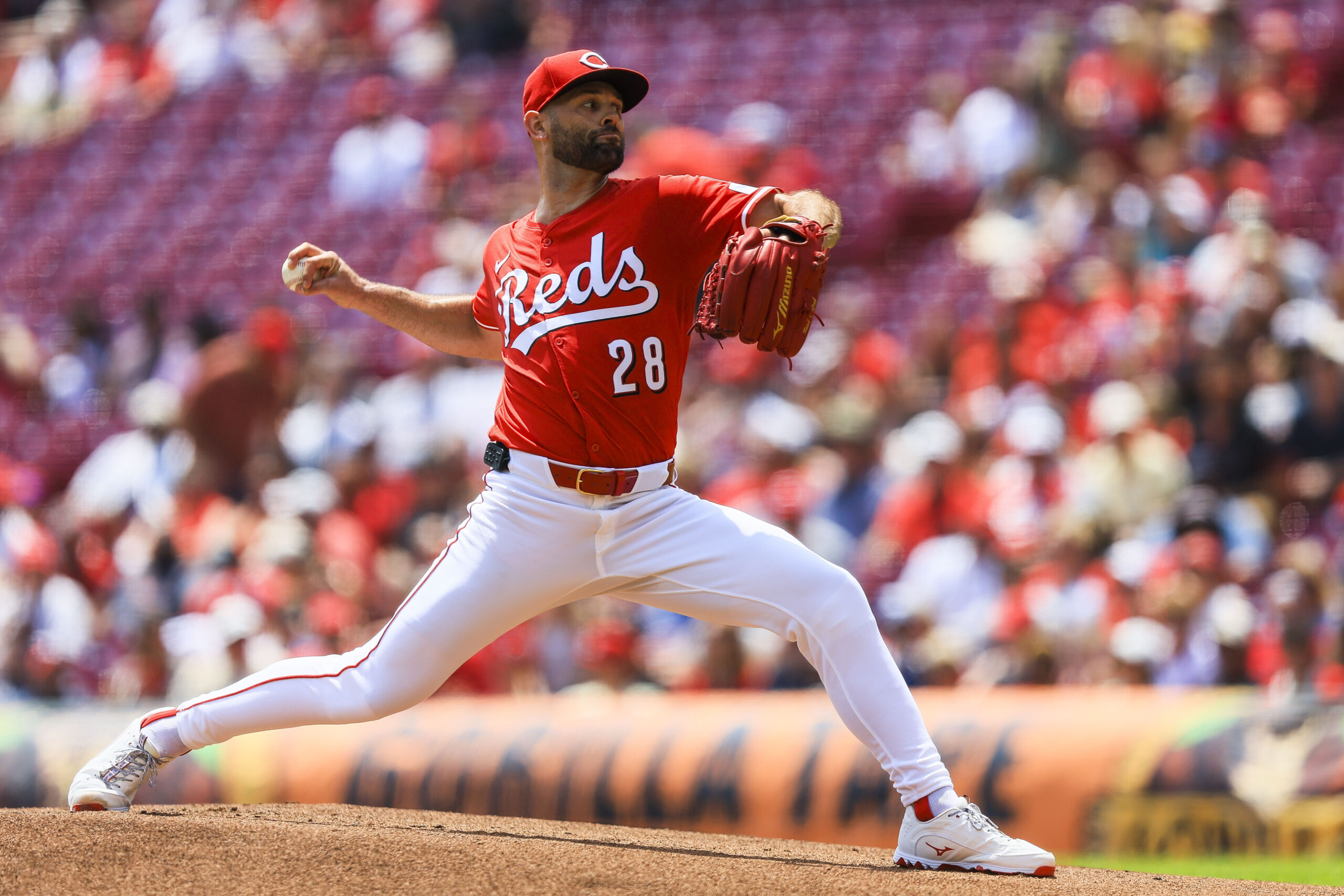 Jul 13, 2025; Cincinnati, Ohio, USA; Cincinnati Reds starting pitcher Nick Martinez (28) pitches against the Colorado Rockies in the first inning at Great American Ball Park. Mandatory Credit: Katie Stratman-Imagn Images