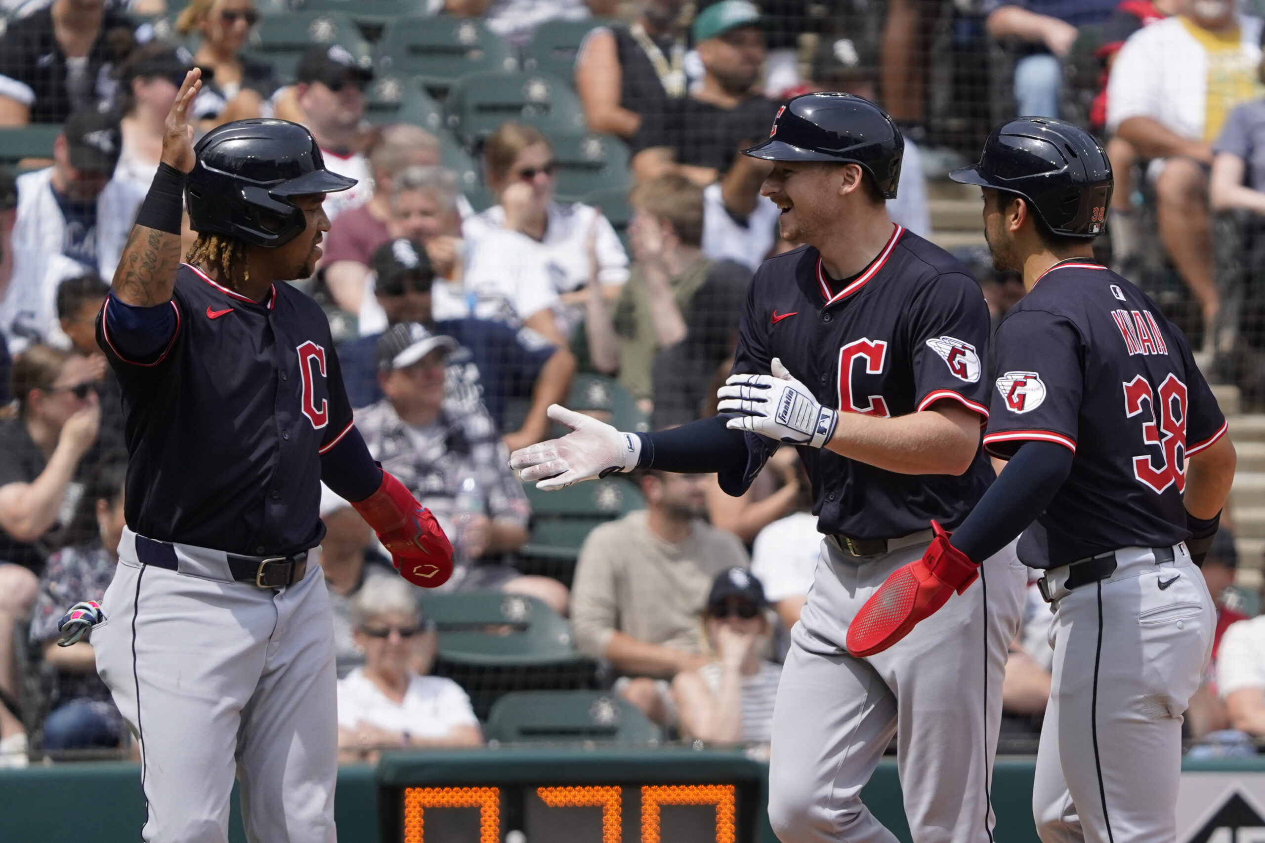 Jul 13, 2025; Chicago, Illinois, USA; Cleveland Guardians first base Kyle Manzardo (C) is greeted by third baseman José Ramírez (L) and outfielder Steven Kwan (38) after hits a three-run home run against the Chicago White Sox during the sixth inning at Rate Field. Mandatory Credit: David Banks-Imagn Images