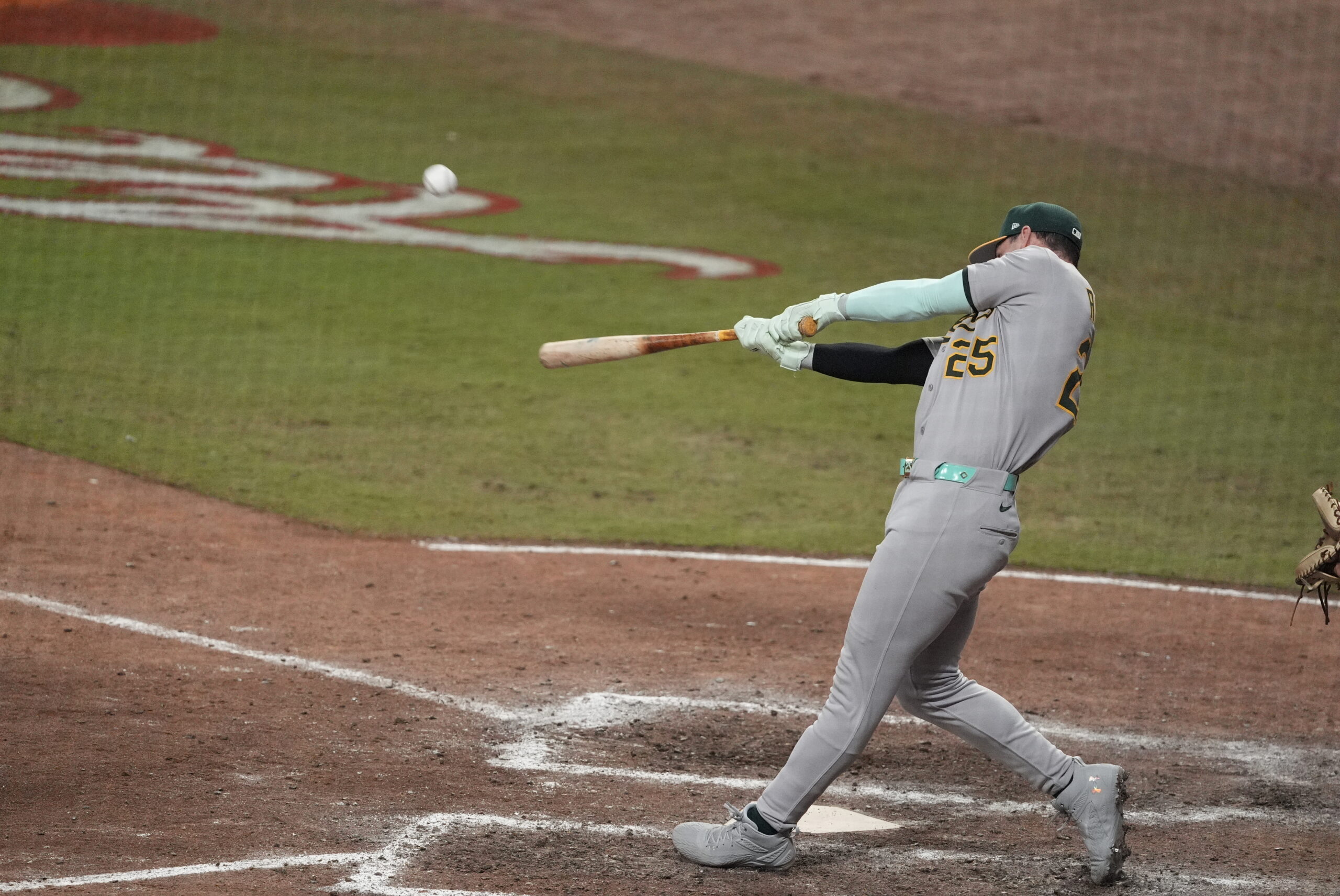 Jul 15, 2025; Cumberland, Georgia, USA; National League designated hitter Brent Rooker (25) of the Athletics hits a home run during the swing off after the 2025 MLB All Star Game ended in a tie at Truist Park. Mandatory Credit: Dale Zanine-Imagn Images