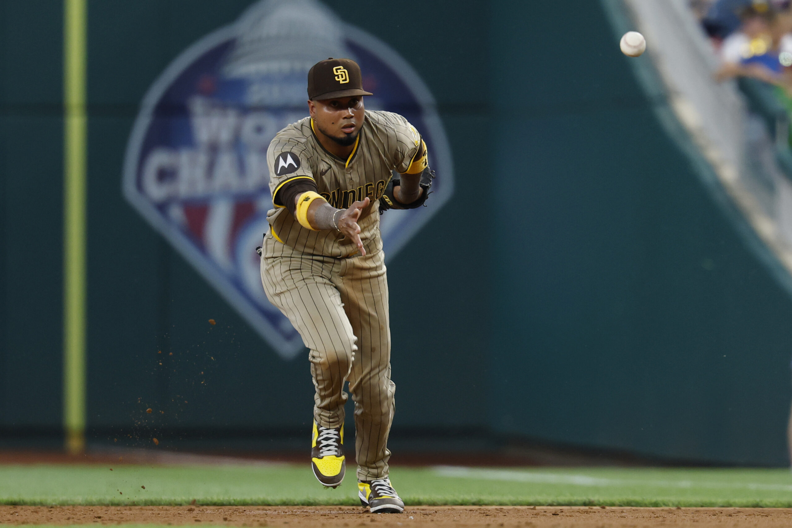 Jul 18, 2025; Washington, District of Columbia, USA; San Diego Padres first baseman Luis Arraez (4) tosses a fielded ground ball to first base against the Washington Nationals during the third inning at Nationals Park. Mandatory Credit: Geoff Burke-Imagn Images