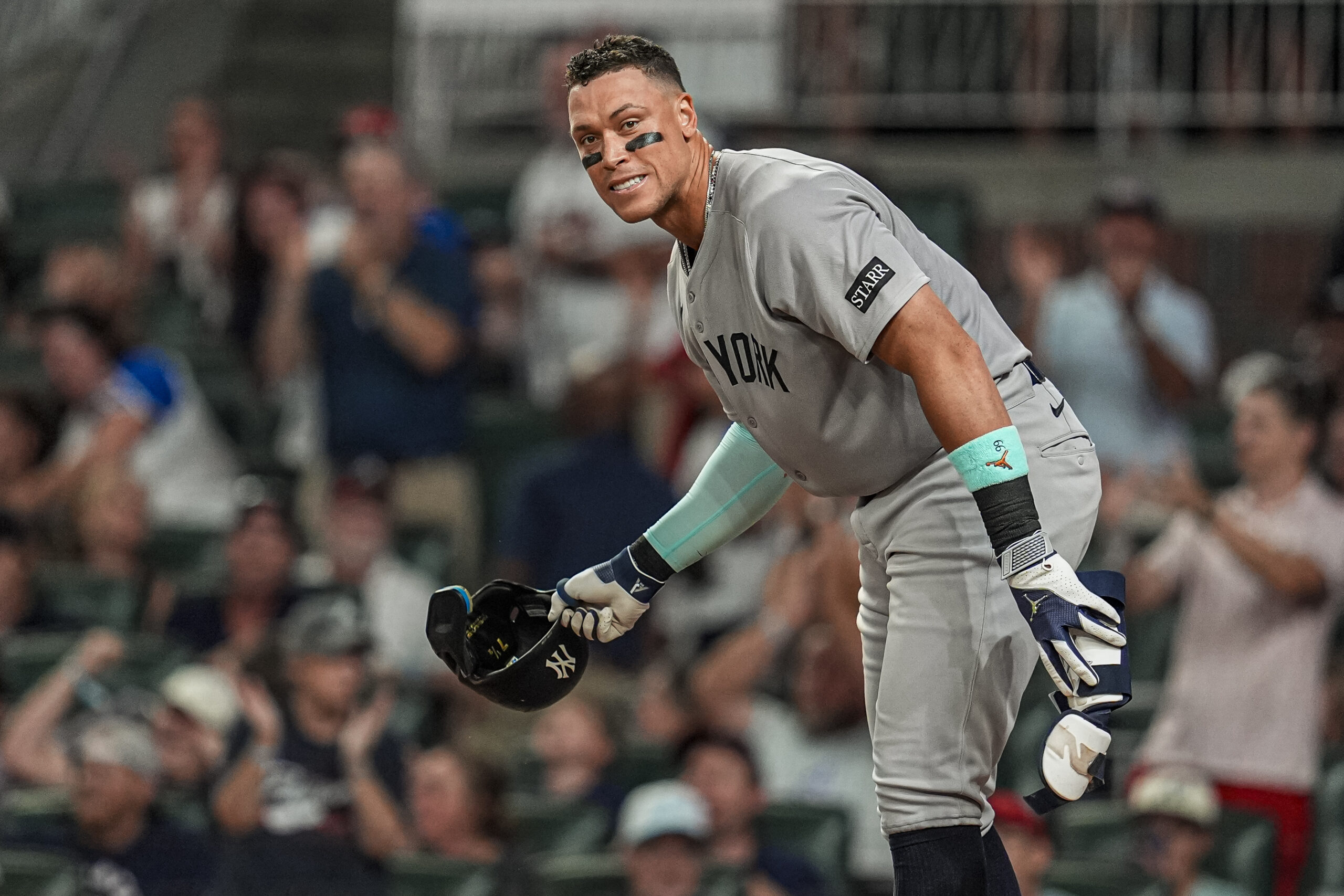 Jul 18, 2025; Cumberland, Georgia, USA; New York Yankees right fielder Aaron Judge (99) reacts after striking out against the Atlanta Braves during the seventh inning at Truist Park. Mandatory Credit: Dale Zanine-Imagn Images