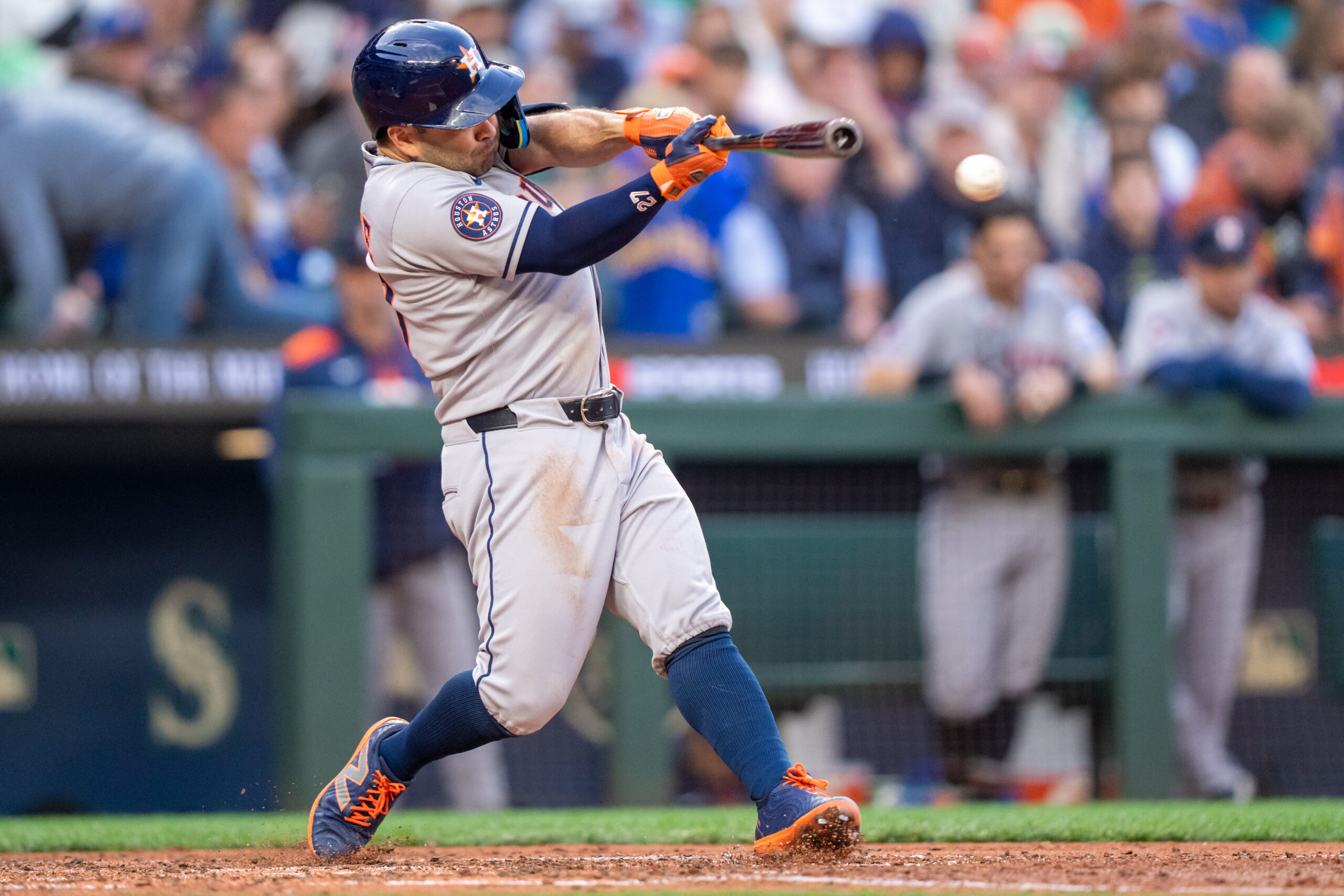 Jul 19, 2025; Seattle, Washington, USA; Houston Astros left fielder Jose Altuve (27) hits a double during the fifth inning against the Seattle Mariners at T-Mobile Park. Mandatory Credit: Stephen Brashear-Imagn Images