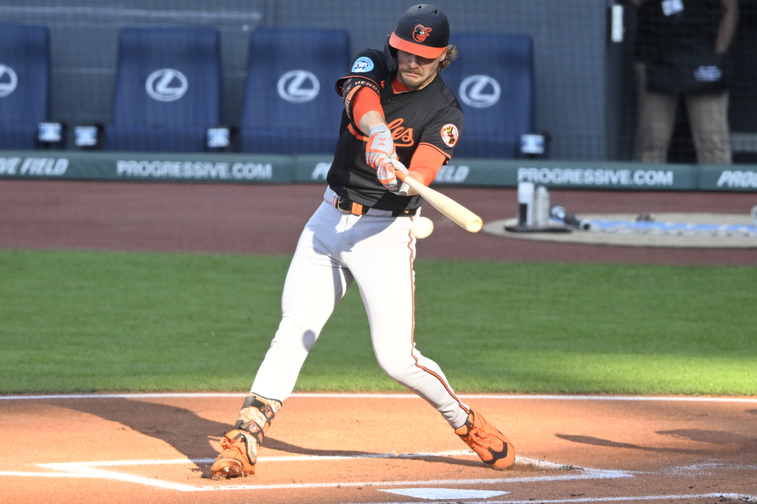 Jul 21, 2025; Cleveland, Ohio, USA; Baltimore Orioles shortstop Gunnar Henderson (2) hits an RBI single in the first inning against the Cleveland Guardians at Progressive Field. Mandatory Credit: David Richard-Imagn Images