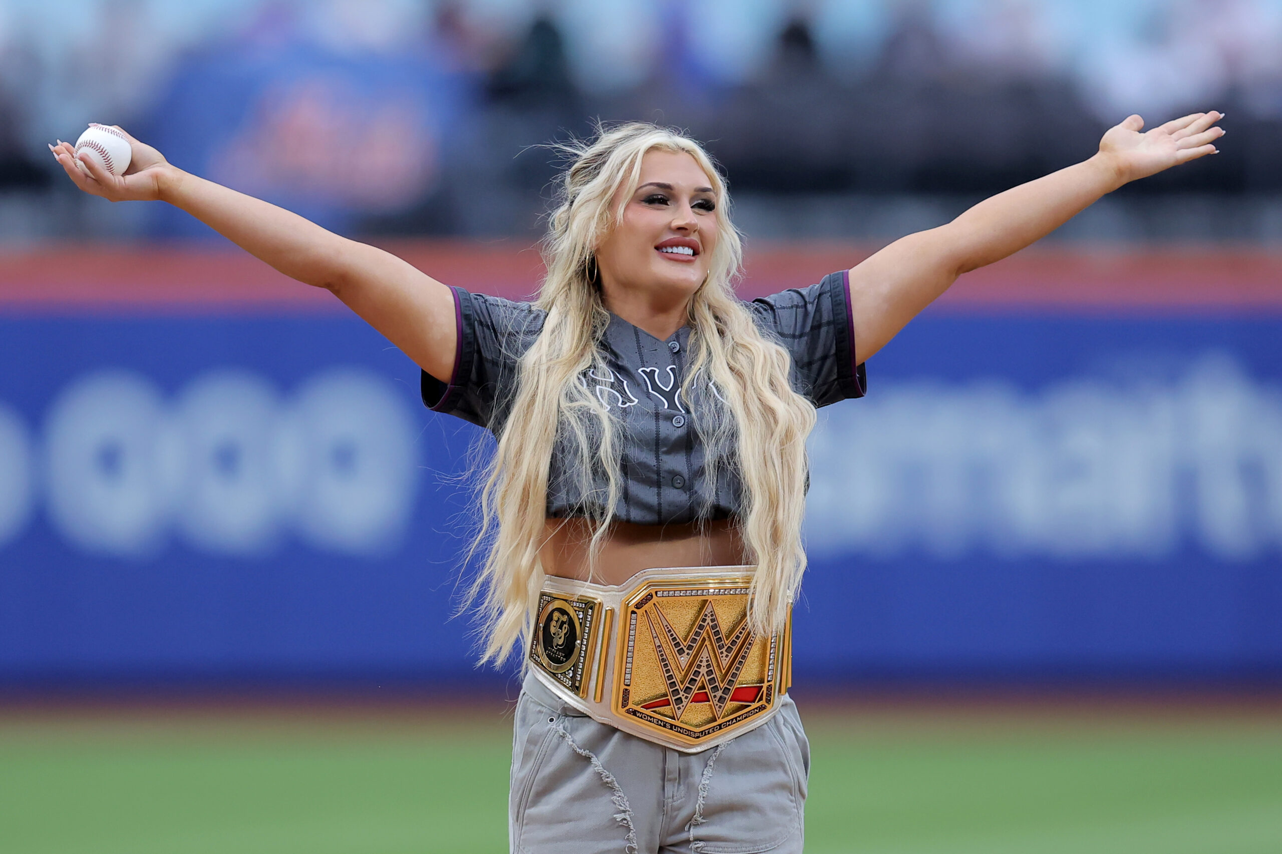 Jul 21, 2025; New York City, New York, USA; Professional wrestler Tiffany Stratton gestures before a ceremonial first pitch before a game between the New York Mets and the Los Angeles Angels at Citi Field. Mandatory Credit: Brad Penner-Imagn Images