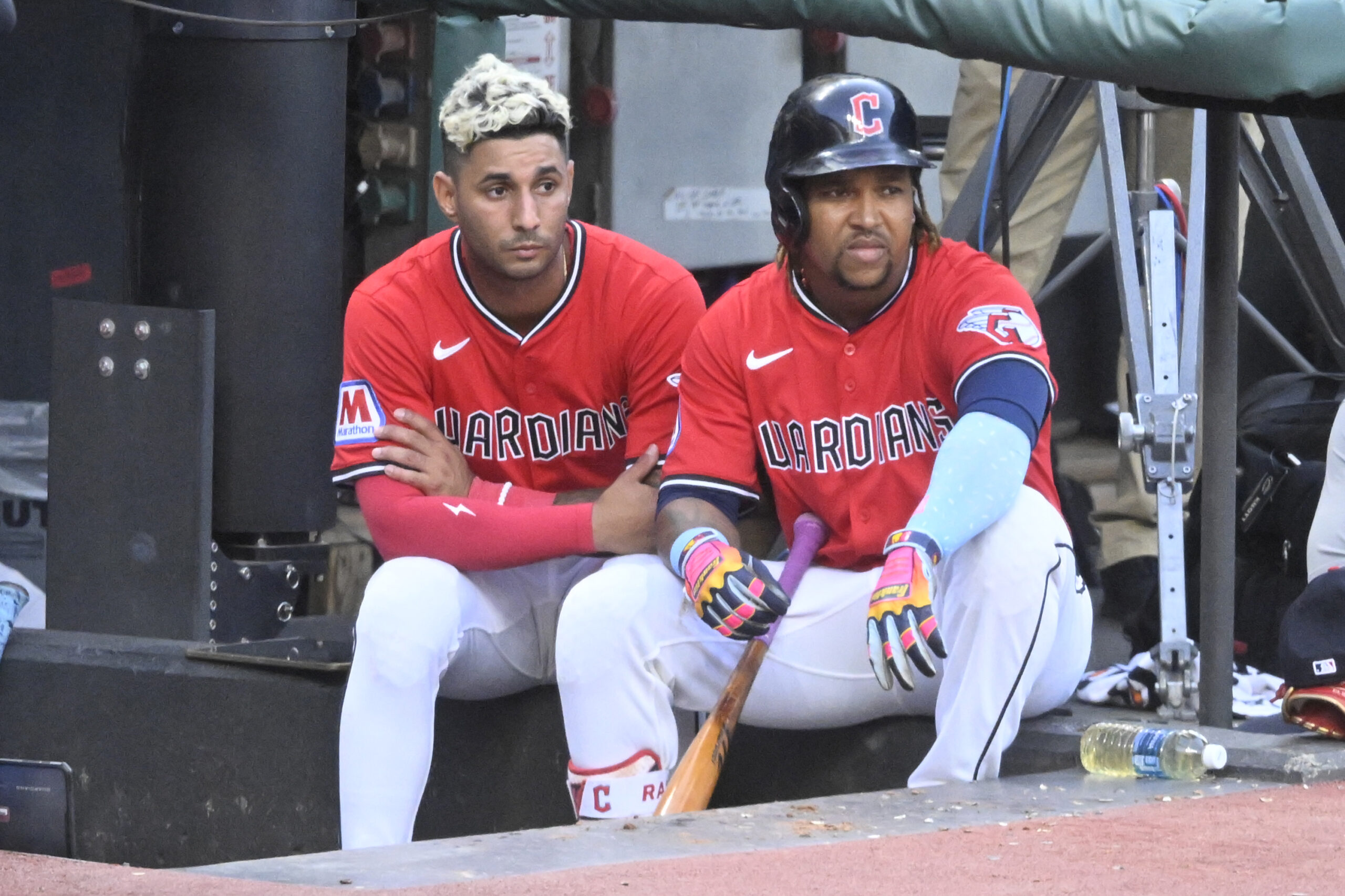 Jul 22, 2025; Cleveland, Ohio, USA; Cleveland Guardians shortstop Brayan Rocchio (4) and third baseman Jose Ramirez (11) sit in the dugout in the fifth inning against the Baltimore Orioles at Progressive Field. Mandatory Credit: David Richard-Imagn Images