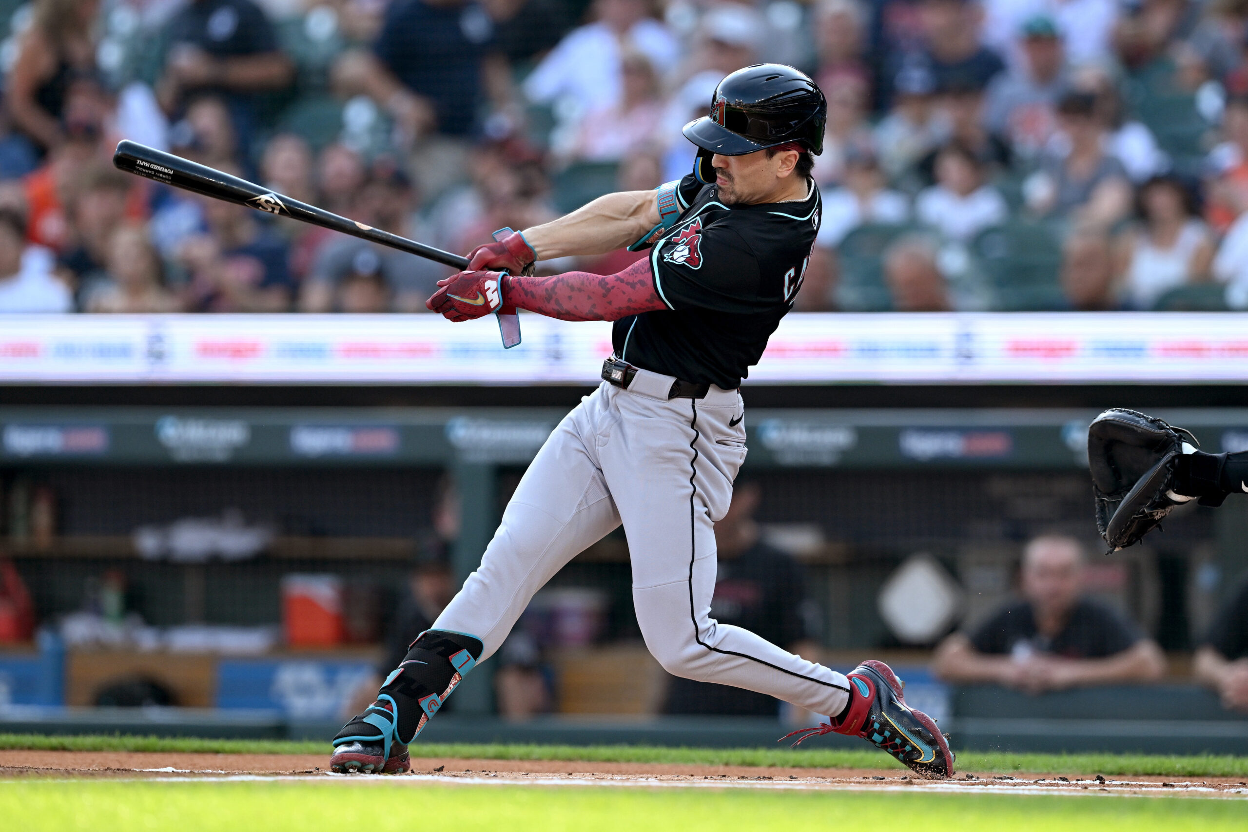 Jul 29, 2025; Detroit, Michigan, USA; Arizona Diamondbacks right fielder Corbin Carroll (7) hits a leadoff triple against the Detroit Tigers in the first inning at Comerica Park. Mandatory Credit: Lon Horwedel-Imagn Images
