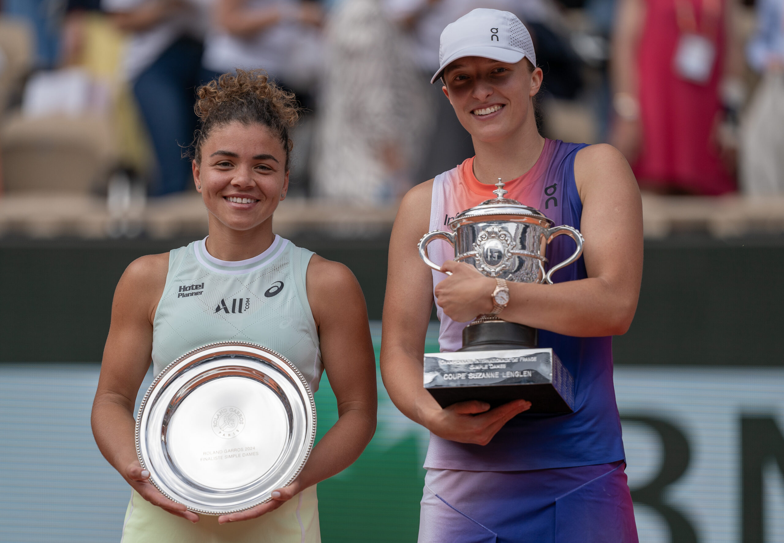 Jun 8, 2024; Paris, France; Iga Swiatek of Poland and Jasmine Paolini of Italy pose with their trophies after the womenÃs final on day 14 of Roland Garros at Stade Roland Garros. Mandatory Credit: Susan Mullane-Imagn Images