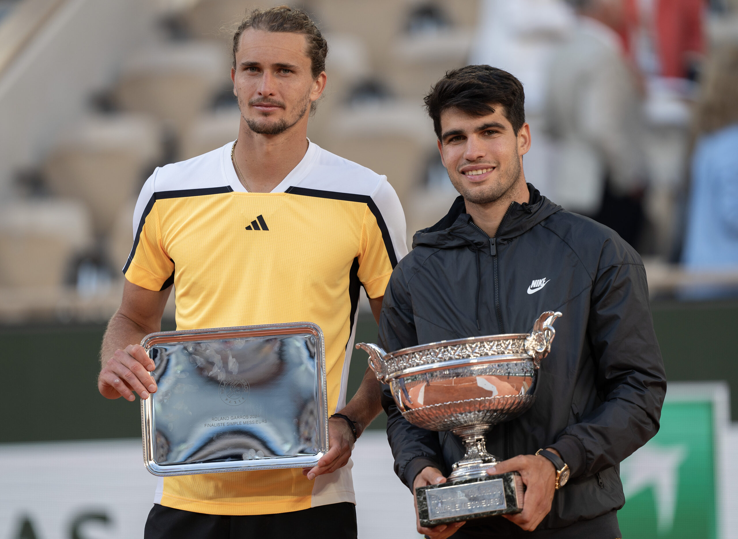 Jun 9, 2024; Paris, France; Carlos Alcaraz of Spain and Alexander Zverev of Germany pose with their trophies at the trophy presentation on day 15 of Roland Garros at Stade Roland Garros. Mandatory Credit: Susan Mullane-Imagn Images