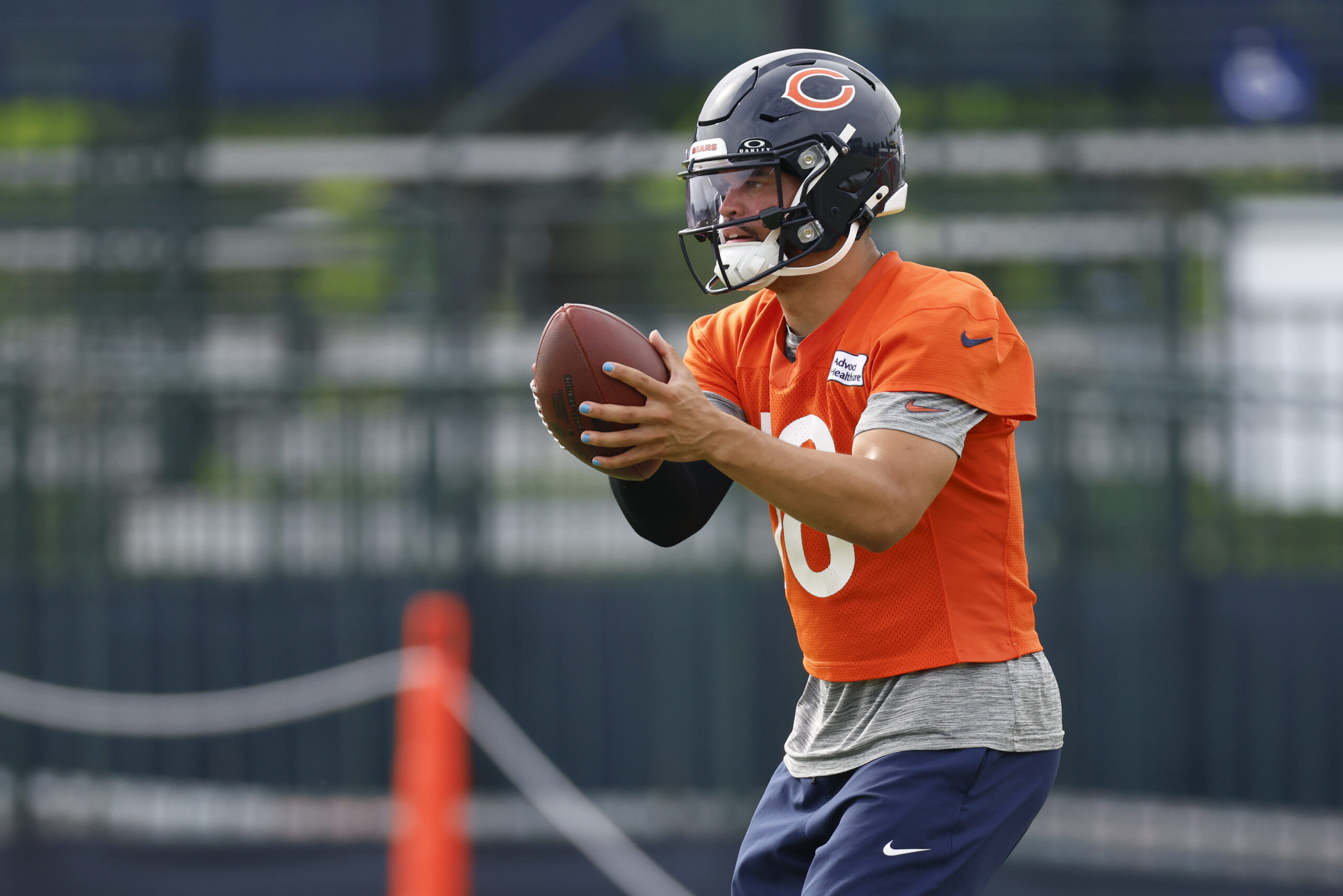 Jul 24, 2025; Lake Forest, IL, USA; Chicago Bears quarterback Caleb Williams (18) looks to pass the ball during training camp at Halas Hall. Mandatory Credit: Kamil Krzaczynski-Imagn Images