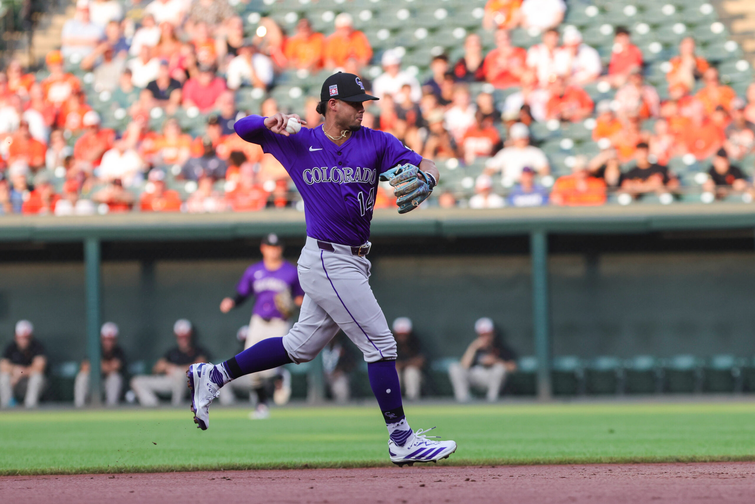 Jul 26, 2025; Baltimore, Maryland, USA; Colorado Rockies shortstop Ezequiel Tovar (14) making a play at first for the out against the Baltimore Orioles at Oriole Park at Camden Yards. Mandatory Credit: Lexi Thompson-Imagn Images