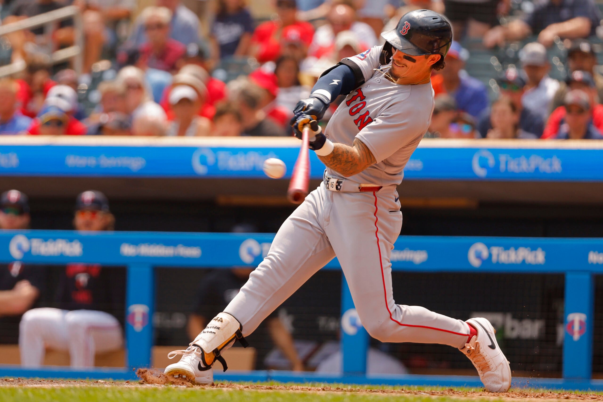 Jul 30, 2025; Minneapolis, Minnesota, USA; Boston Red Sox center fielder Jarren Duran (16) hits a two run home run against the Minnesota Twins in the sixth inning at Target Field. Mandatory Credit: Bruce Kluckhohn-Imagn Images