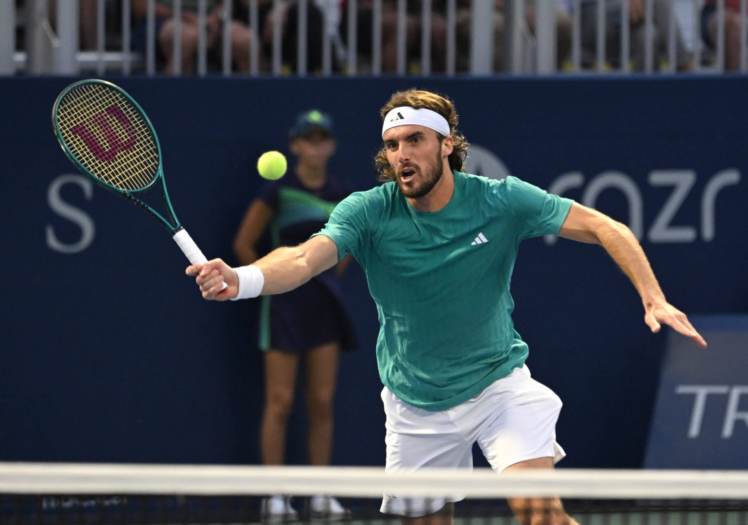 Jul 30, 2025; Toronto, ON, Canada; Stefanos Tsitsipas (GRE) plays a shot against Christopher O'Connell (AUS) during second round play at Sobeys Stadium. Mandatory Credit: Dan Hamilton-Imagn Images