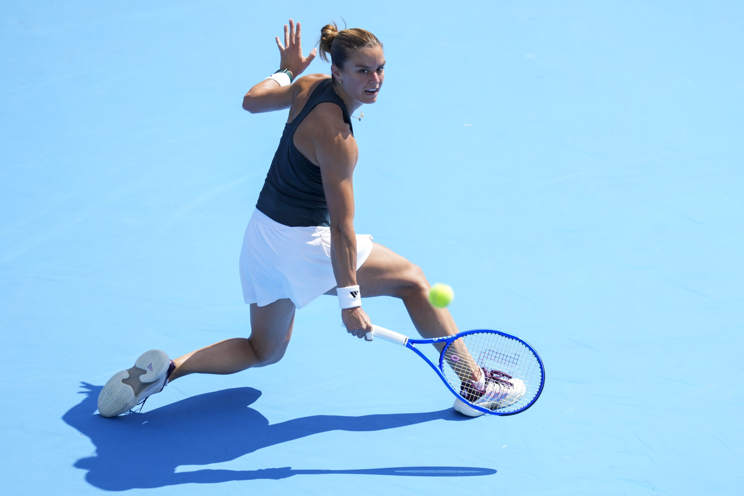 Aug 8, 2025; Cincinnati, OH, USA; Maria Sakkari (GRE) returns a shot against Kamilla Rakhimova (RUS) during the Cincinnati Open at the Lindner Family Tennis Center. Mandatory Credit: Aaron Doster-Imagn Images