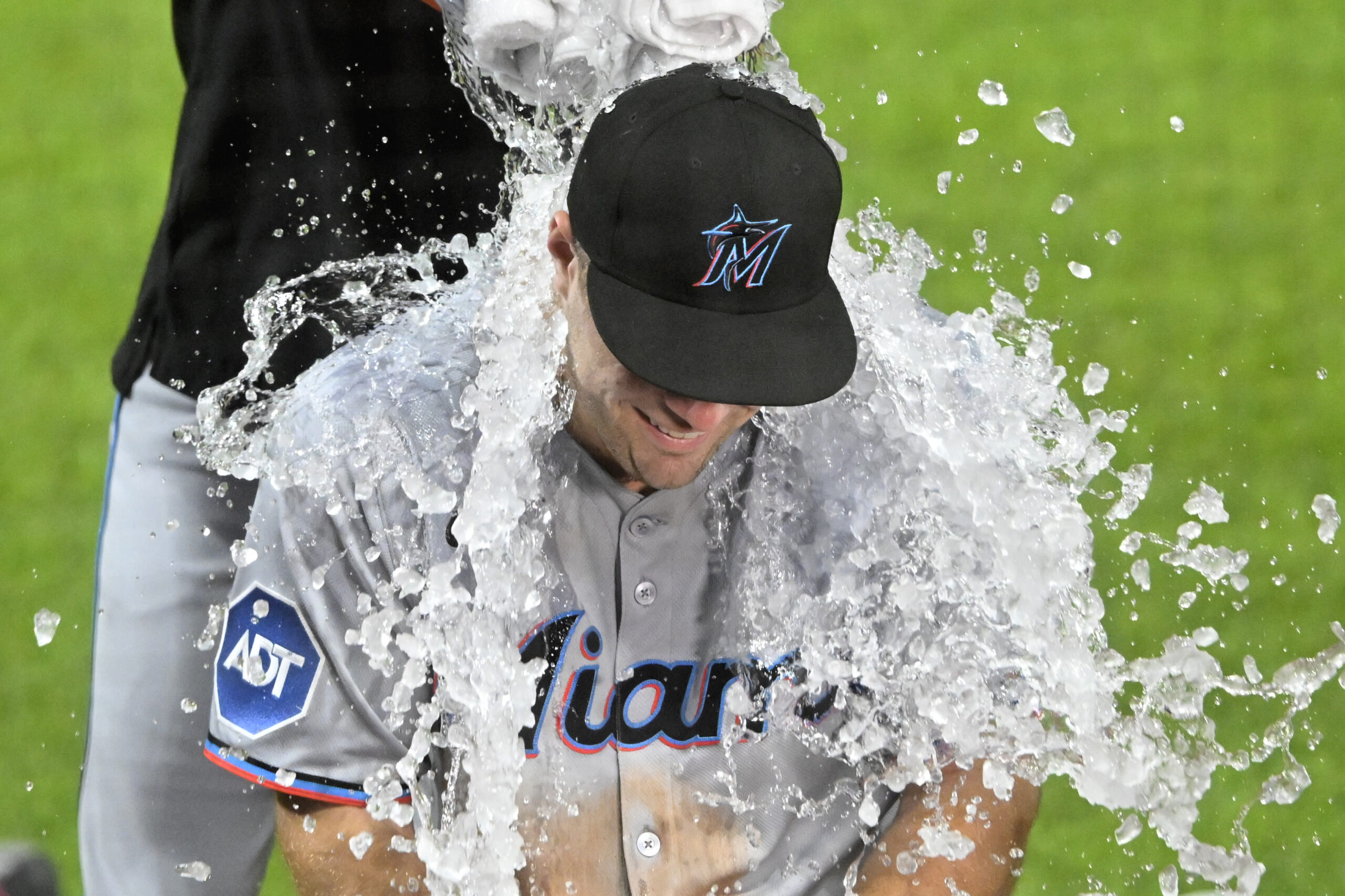 Aug 13, 2025; Cleveland, Ohio, USA; Miami Marlins center fielder Jakob Marsee (87) gets an ice water bath after a win over the Cleveland Guardians at Progressive Field. Mandatory Credit: David Richard-Imagn Images