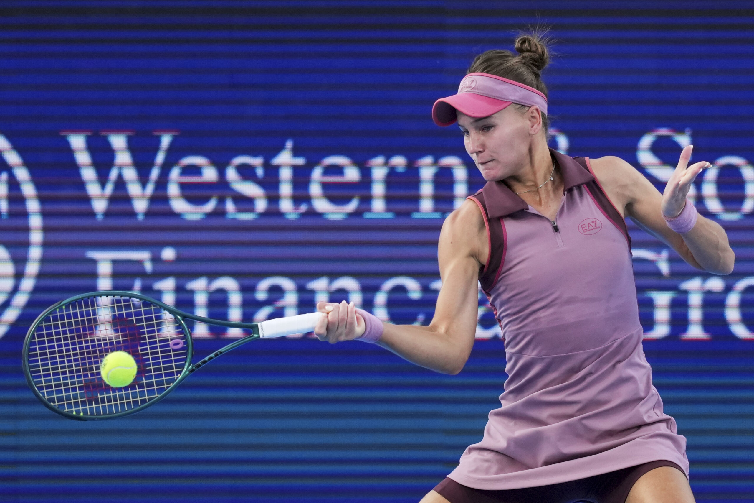 Aug 14, 2025; Cincinnati, OH, USA; Veronika Kudermetova (RUS) returns a shot against Magda Linette (POL) during the Cincinnati Open at the Lindner Family Tennis Center. Mandatory Credit: Aaron Doster-Imagn Images