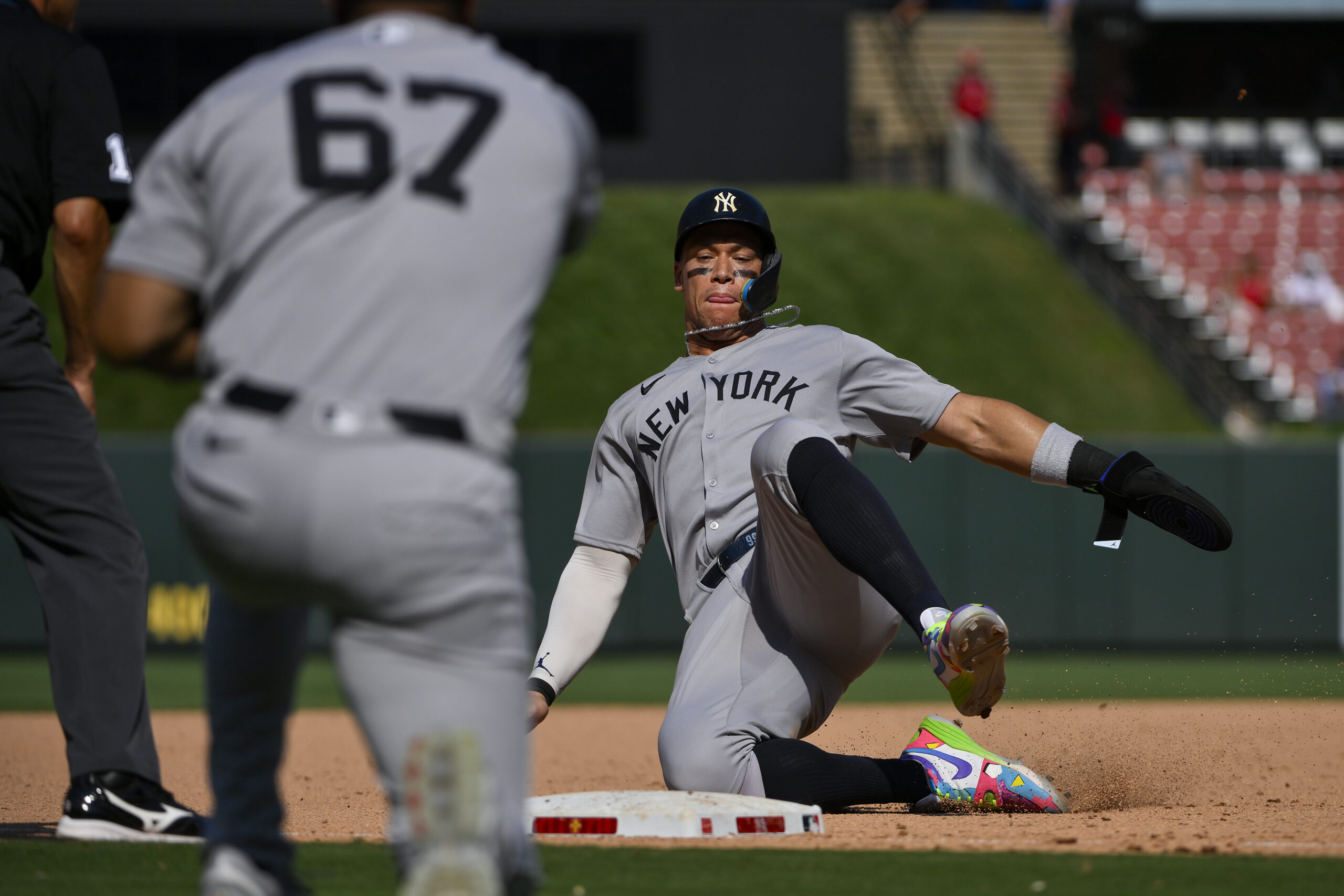 Aug 17, 2025; St. Louis, Missouri, USA;  New York Yankees designated hitter Aaron Judge (99) slides in at third base against the St. Louis Cardinals during the ninth inning at Busch Stadium. Mandatory Credit: Jeff Curry-Imagn Images