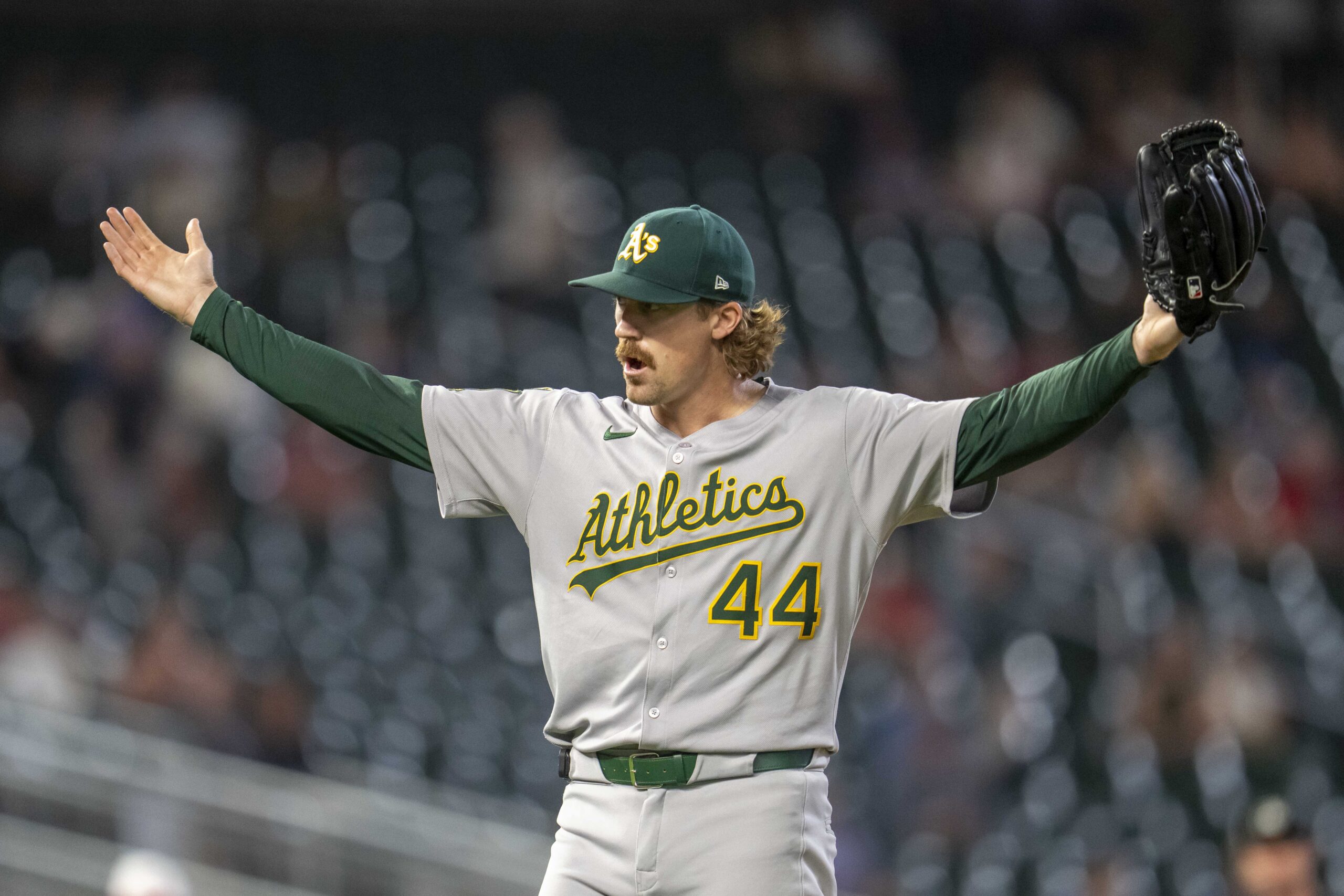Aug 20, 2025; Minneapolis, Minnesota, USA; Athletics pitcher Tyler Ferguson (44) celebrates after defeating the Minnesota Twins at Target Field. Mandatory Credit: Jesse Johnson-Imagn Images
