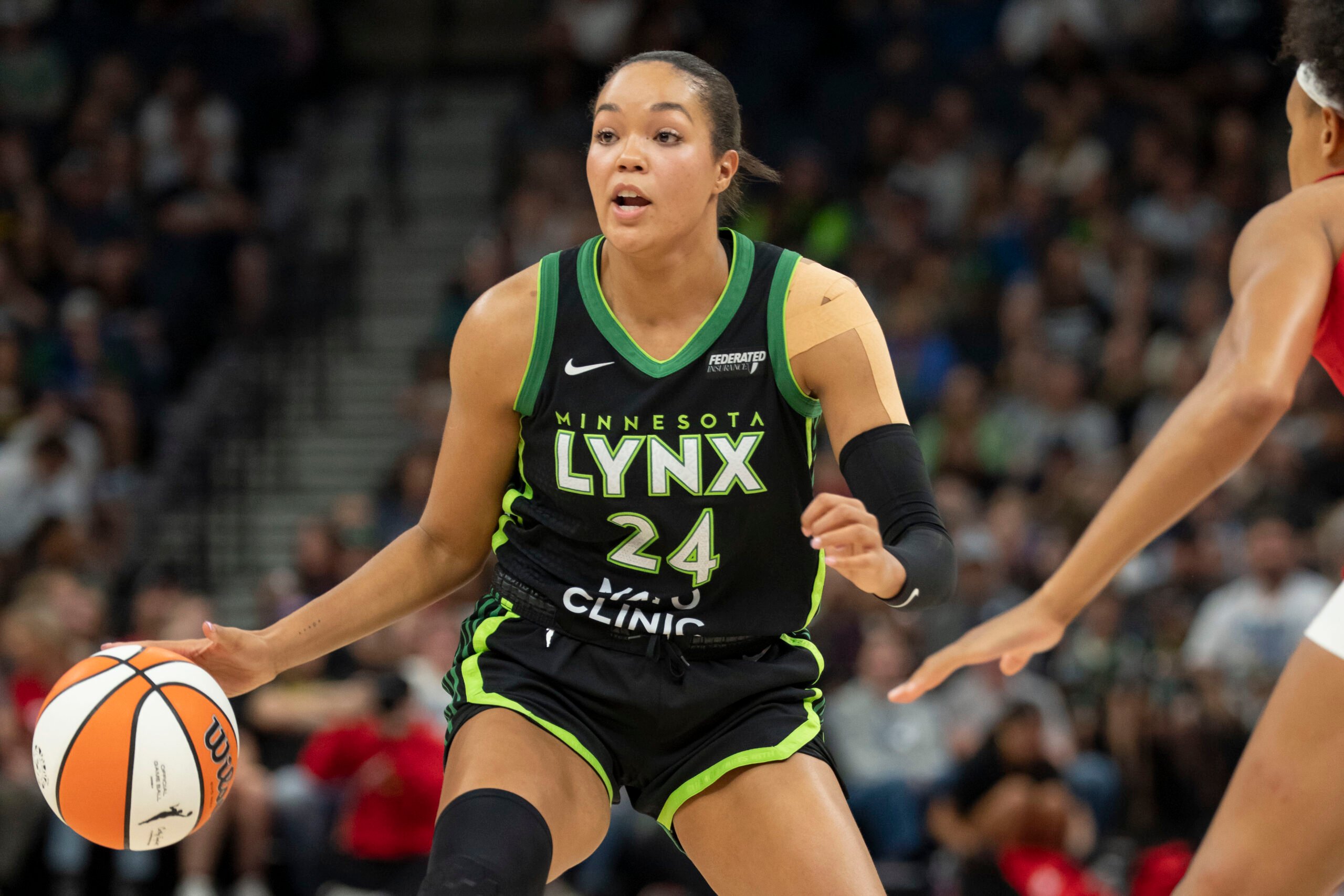 Aug 24, 2025; Minneapolis, Minnesota, USA; Minnesota Lynx forward Napheesa Collier (24) dribbles the ball against the Indiana Fever in the first half at Target Center. Mandatory Credit: Jesse Johnson-Imagn Images