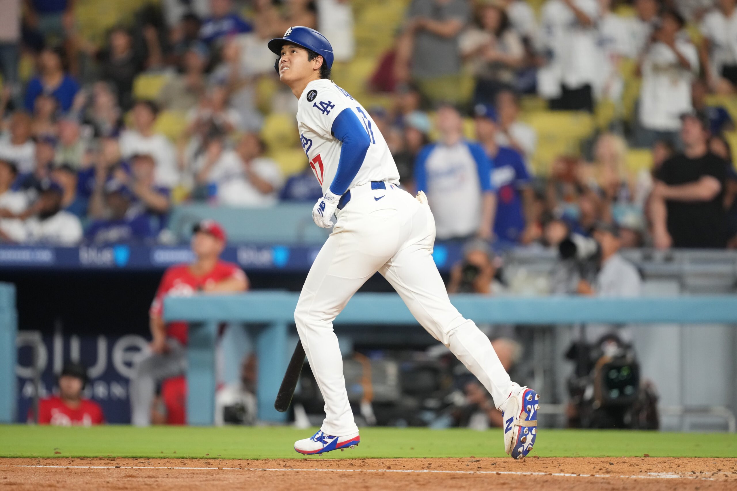 Aug 27, 2025; Los Angeles, California, USA; Los Angeles Dodgers starting pitcher Shohei Ohtani (17) flies out to left field in the eighth inning against the Cincinnati Reds at Dodger Stadium. Mandatory Credit: Kirby Lee-Imagn Images