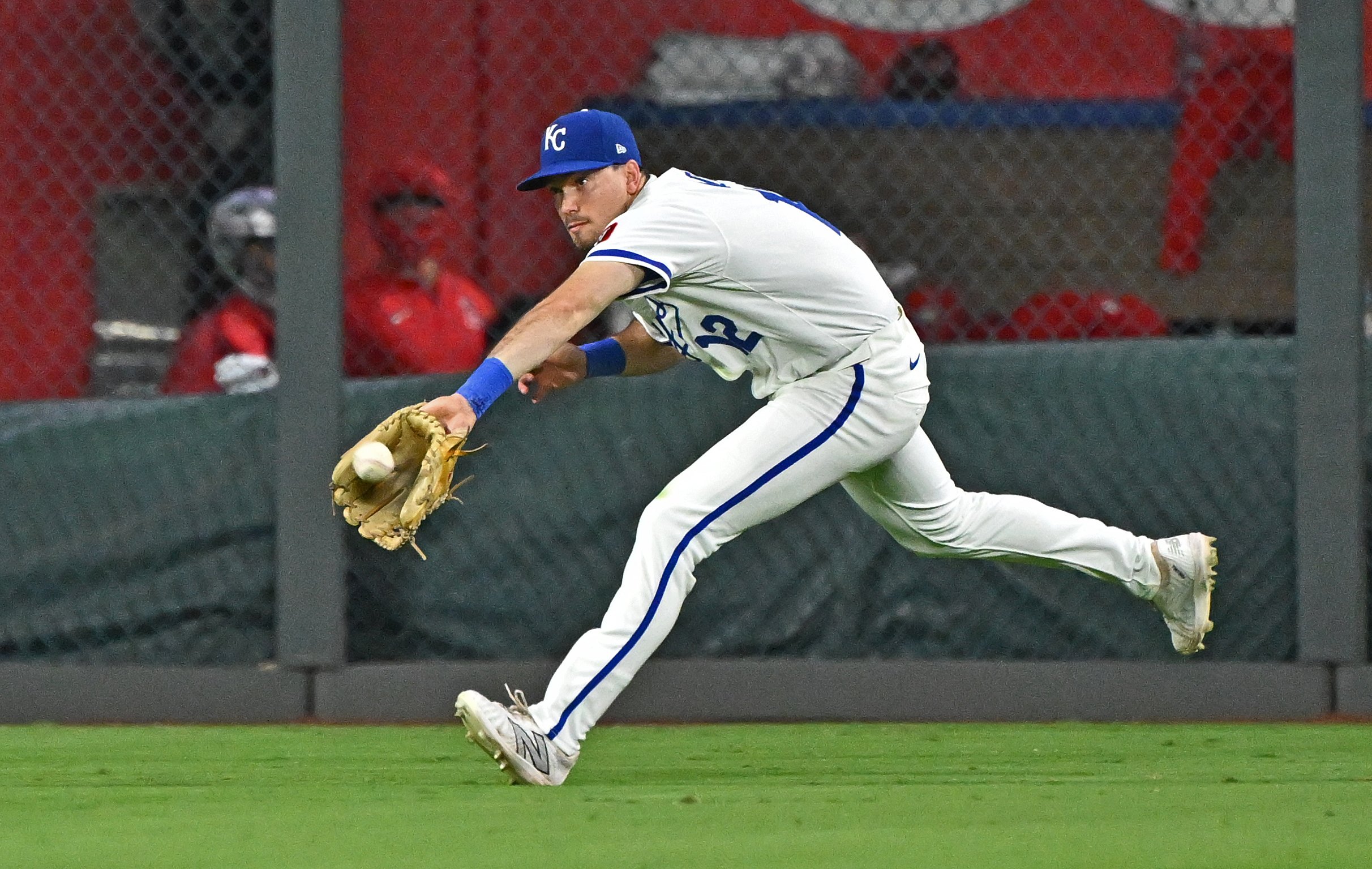 Sep 2, 2025; Kansas City, Missouri, USA; Kansas City Royals left fielder Nick Loftin (12) makes a running catch in the ninth inning against the Los Angeles Angels at Kauffman Stadium. Mandatory Credit: Peter Aiken-Imagn Images