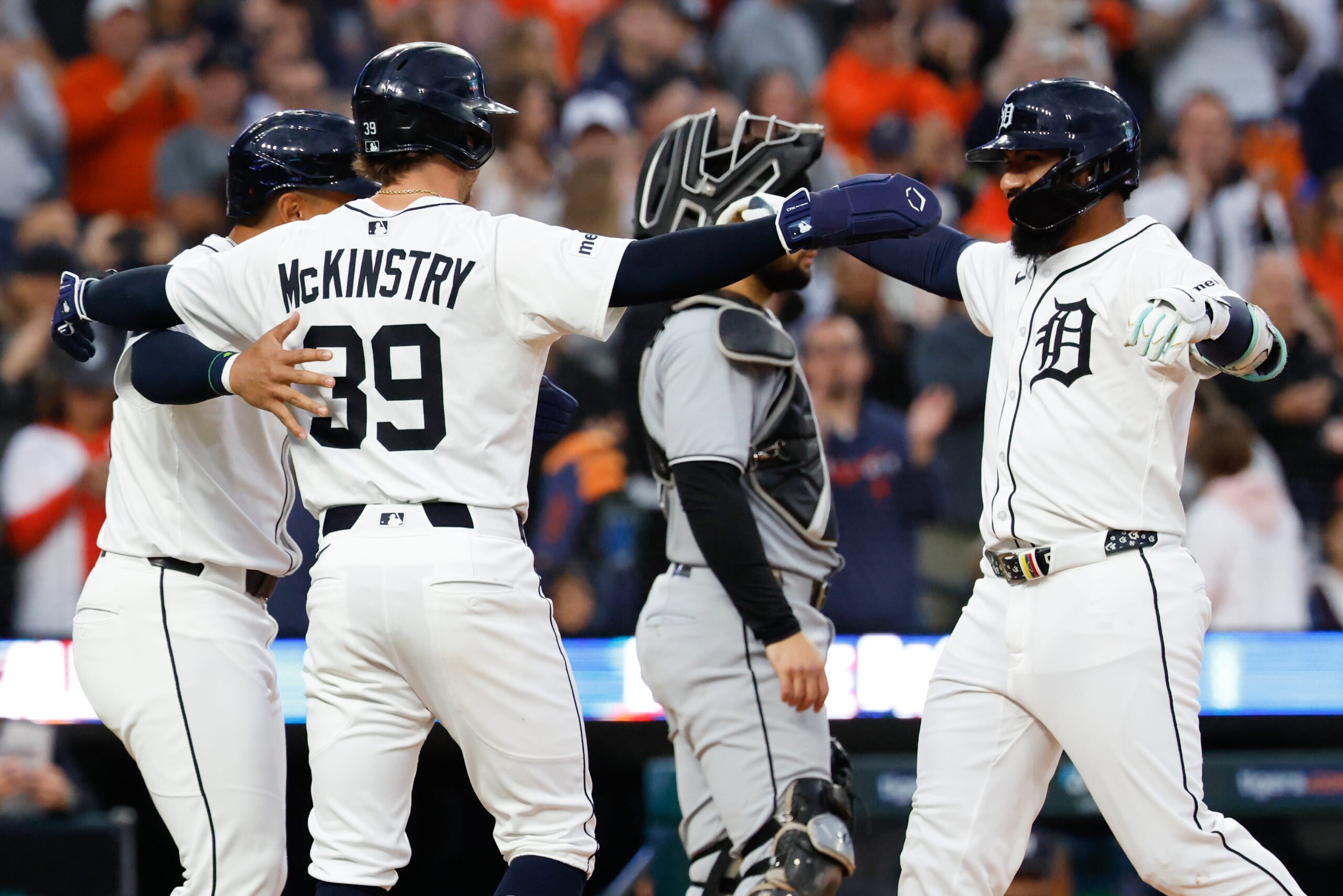 Sep 6, 2025; Detroit, Michigan, USA; Detroit Tigers second base Gleyber Torres (25) celebrates with designated hitter Jahmai Jones (18) and third base Zach McKinstry (39) after he hits a three run home run in the fourth inning against the Chicago White Sox at Comerica Park. Mandatory Credit: Rick Osentoski-Imagn Images