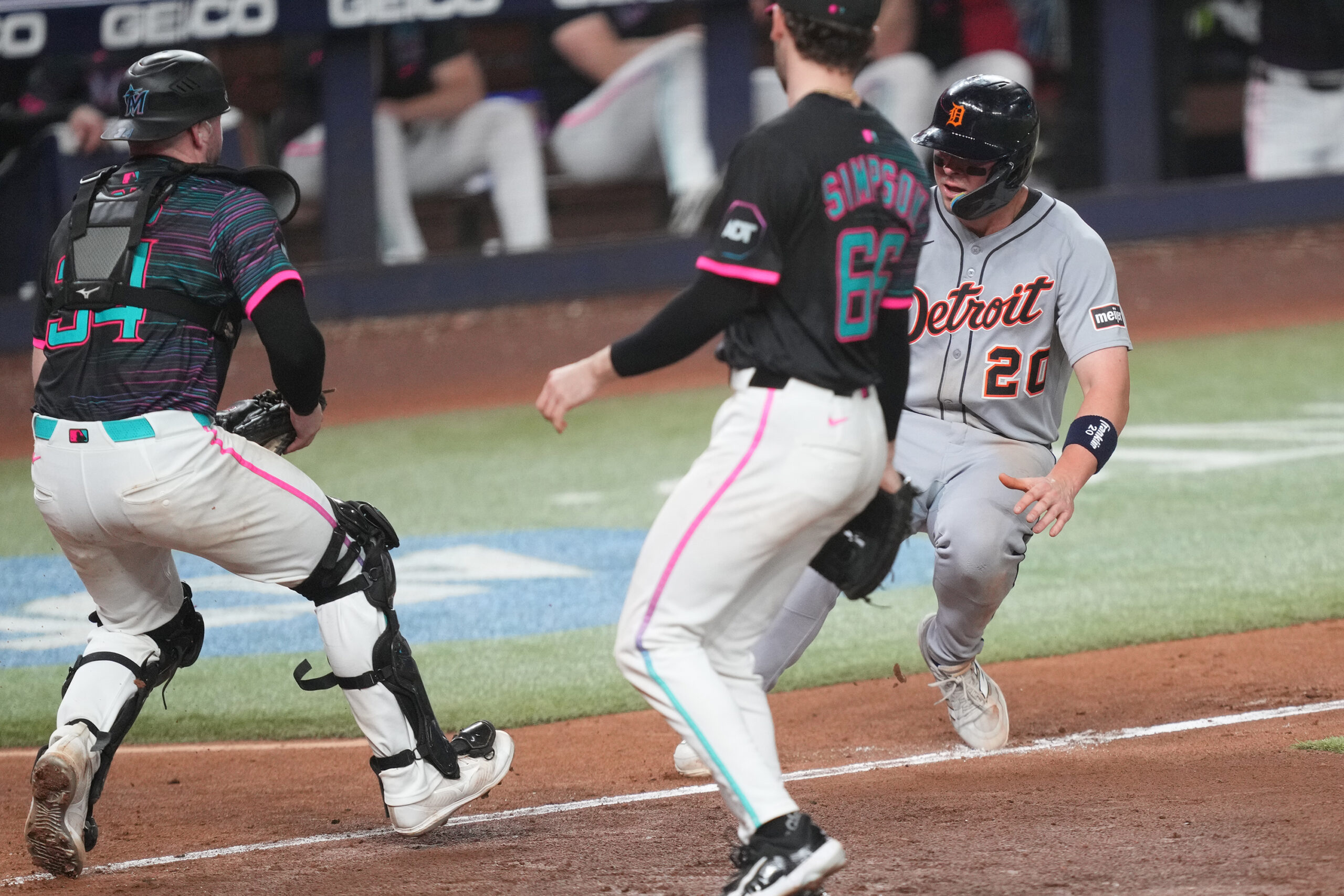 Sep 13, 2025; Miami, Florida, USA; Miami Marlins catcher Liam Hicks (34) runs down Detroit Tigers first baseman Spencer Torkelson (20) at home plate in the 11th inning at loanDepot Park. Mandatory Credit: Jim Rassol-Imagn Images