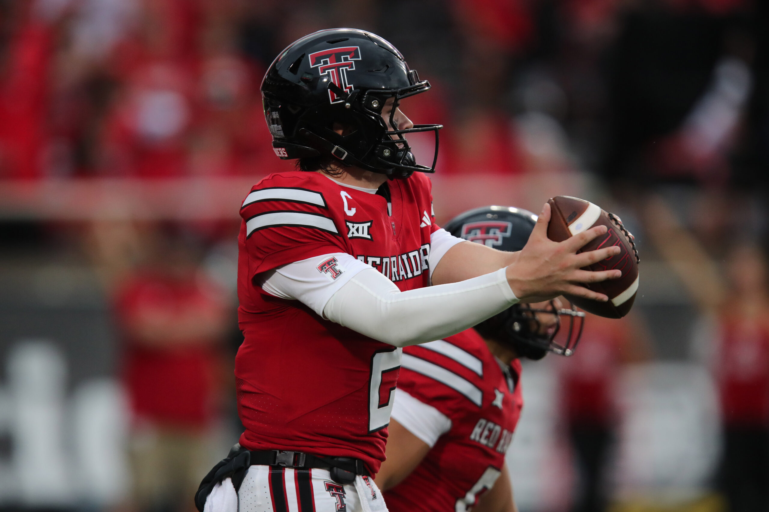 Sep 13, 2025; Lubbock, Texas, USA;  Texas Tech Red Raiders quarterback Behren Morton (2) takes a snap in the second half against the Oregon State Beavers at Jones AT&T Stadium. Mandatory Credit: Michael C. Johnson-Imagn Images