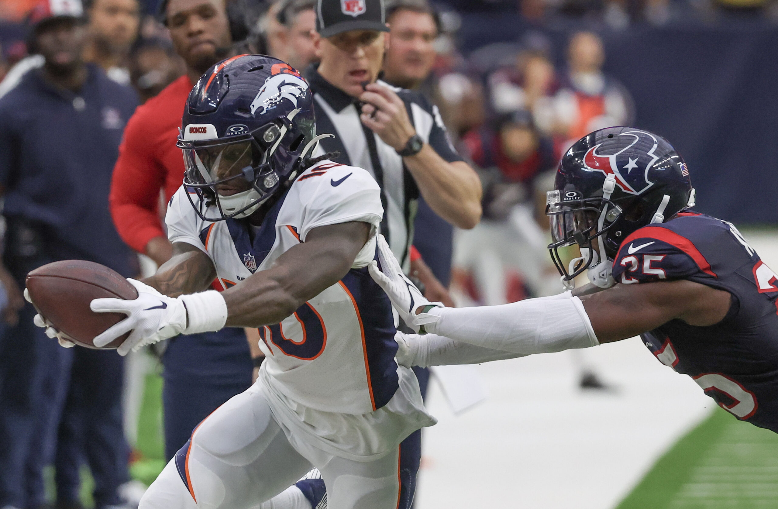 Dec 3, 2023; Houston, Texas, USA;Denver Broncos wide receiver Jerry Jeudy (10) catches the ball against Houston Texans cornerback Desmond King II (25) in the second half at NRG Stadium. Mandatory Credit: Thomas Shea-Imagn Images