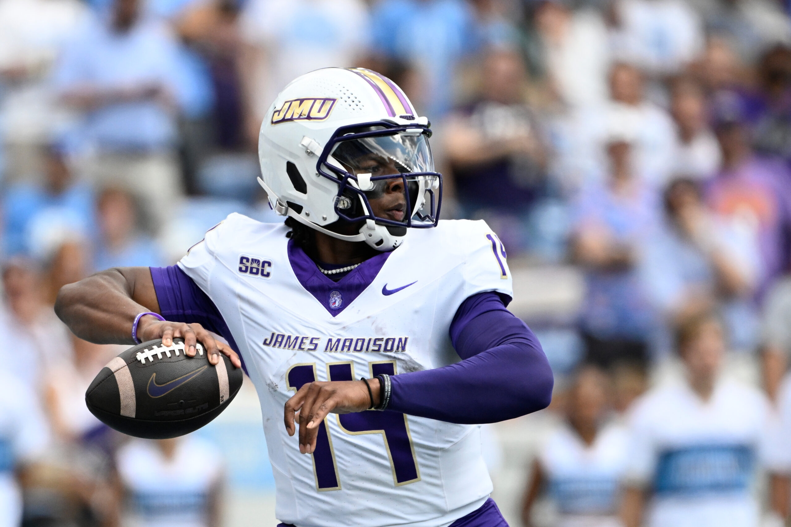 Sep 21, 2024; Chapel Hill, North Carolina, USA; James Madison Dukes quarterback Alonza Barnett III (14) looks to pass in the first quarter at Kenan Memorial Stadium. Mandatory Credit: Bob Donnan-Imagn Images