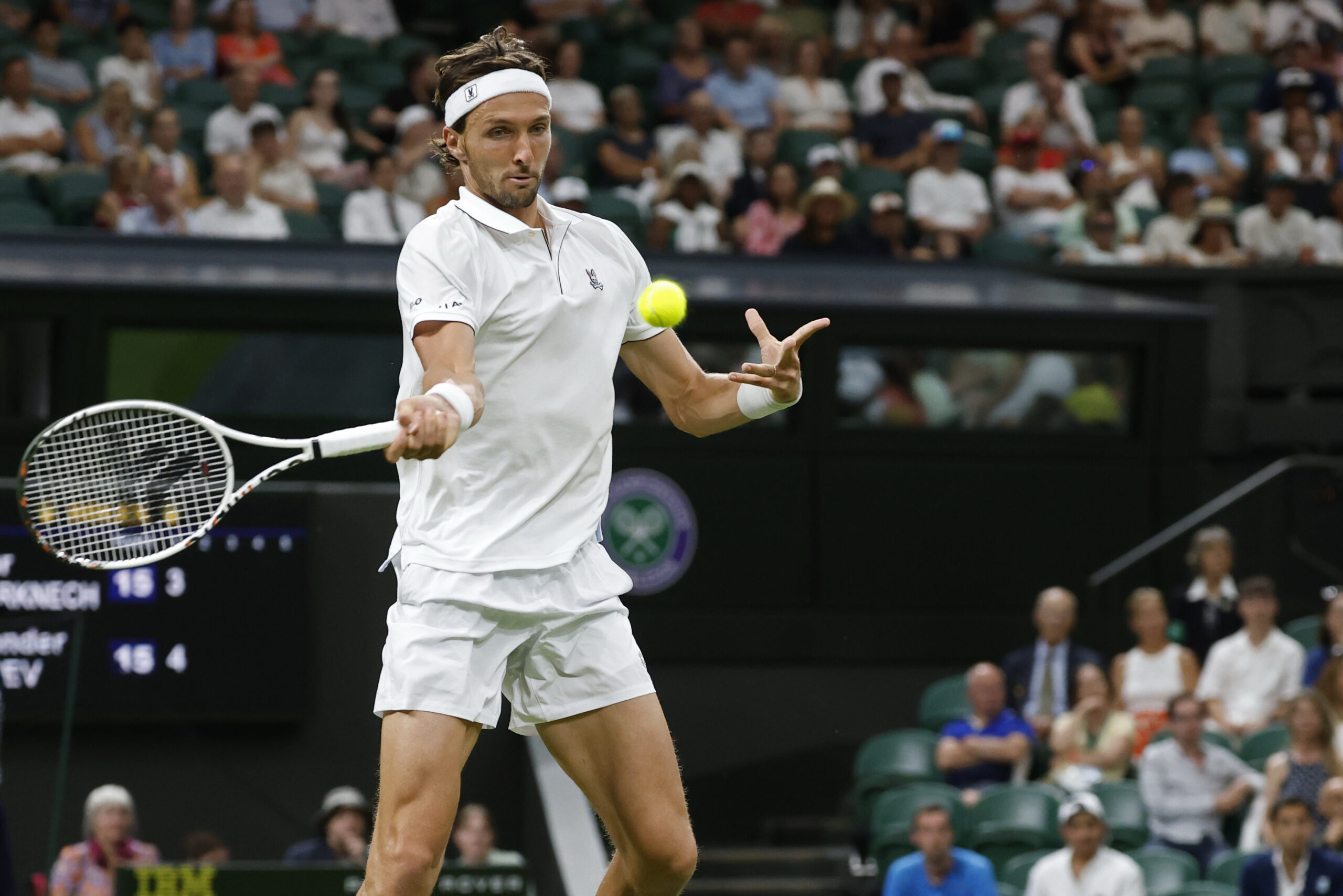 Jun 30, 2025; Wimbledon, United Kingdom; Arthur Rinderknech (FRA) hits a forehand against Alexander Zverev (GER)(not pictured) on day one of The Championships, Wimbledon 2025 at All England Lawn Tennis and Croquet Club. Mandatory Credit: Geoff Burke-Imagn Images