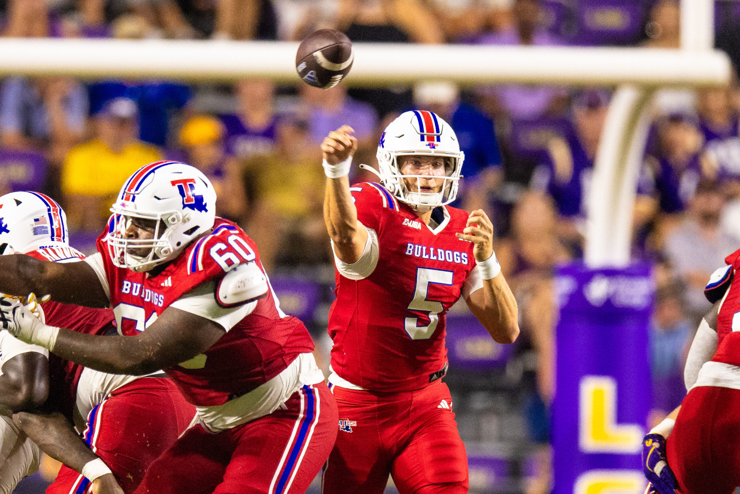 Sep 6, 2025; Baton Rouge, Louisiana, USA;  Louisiana Tech Bulldogs quarterback Blake Baker (5) passes against LSU Tigers during the second half  at Tiger Stadium. Mandatory Credit: Stephen Lew-Imagn Images