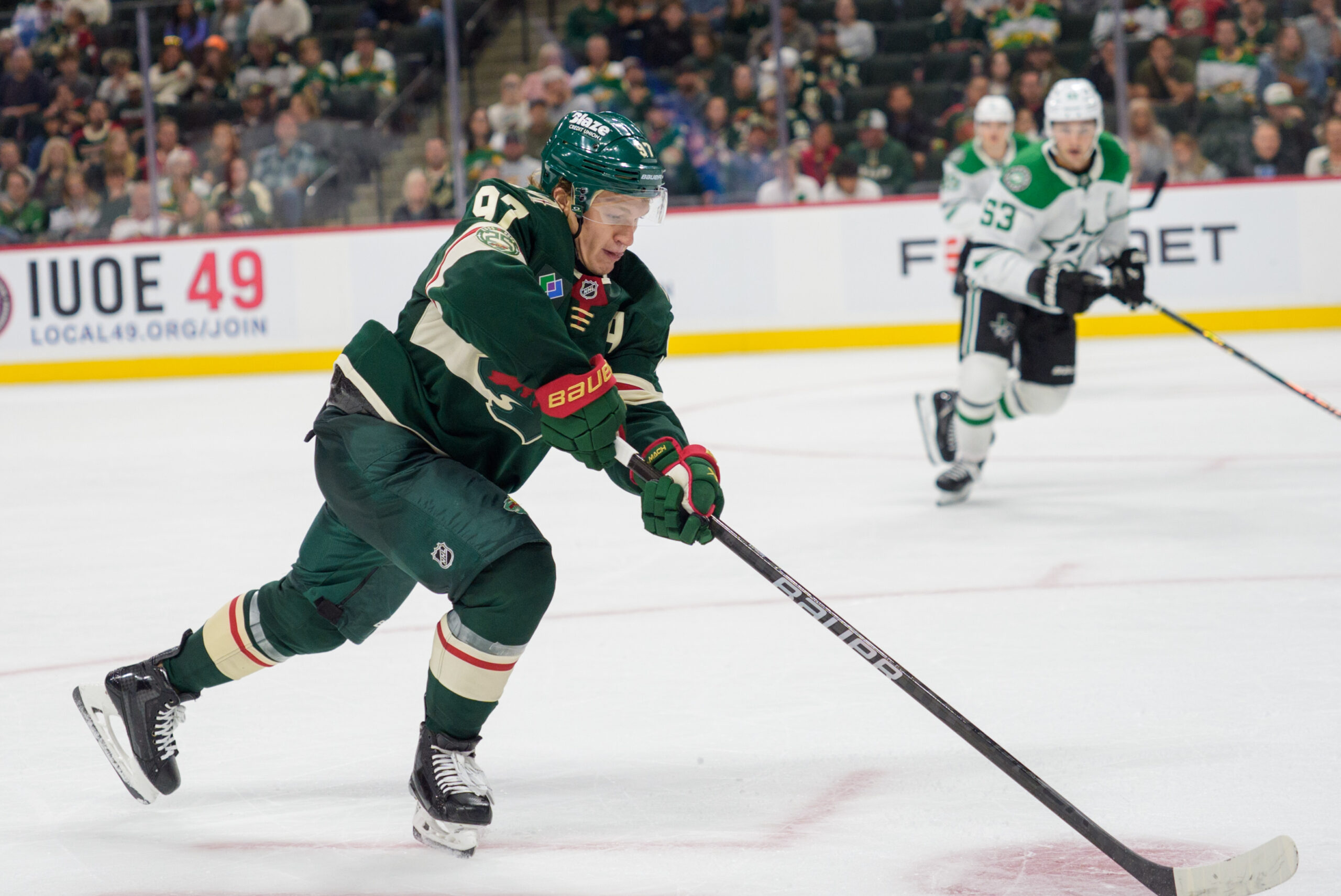 Sep 25, 2025; Saint Paul, Minnesota, USA; Minnesota Wild left wing Kirill Kaprizov (97) controls a pass against the Dallas Stars in the third period at Grand Casino Arena. Mandatory Credit: Matt Blewett-Imagn Images