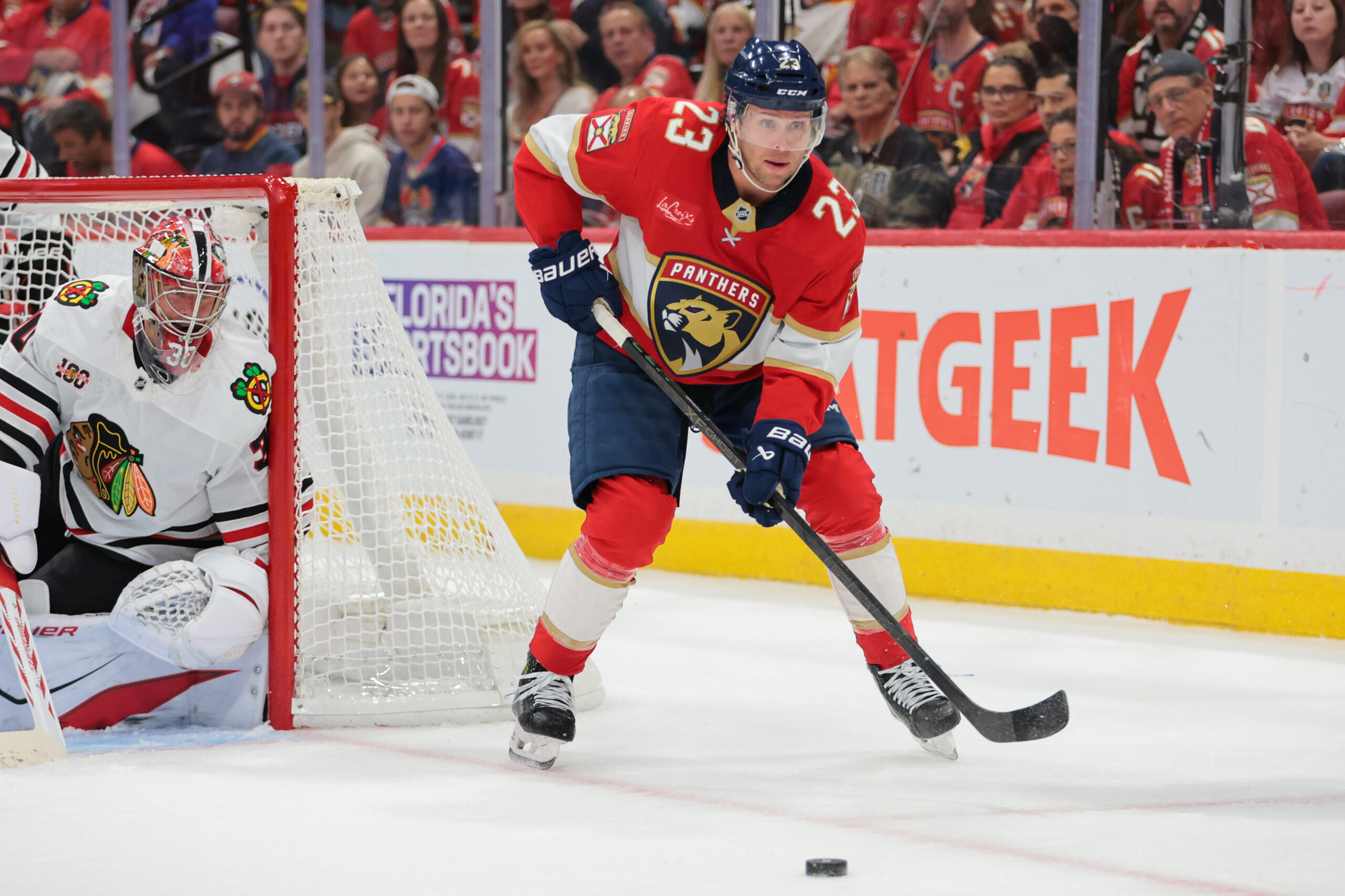 Oct 7, 2025; Sunrise, Florida, USA; Florida Panthers center Carter Verhaeghe (23) moves the puck against the Chicago Blackhawks during the first period at Amerant Bank Arena. Mandatory Credit: Sam Navarro-Imagn Images
