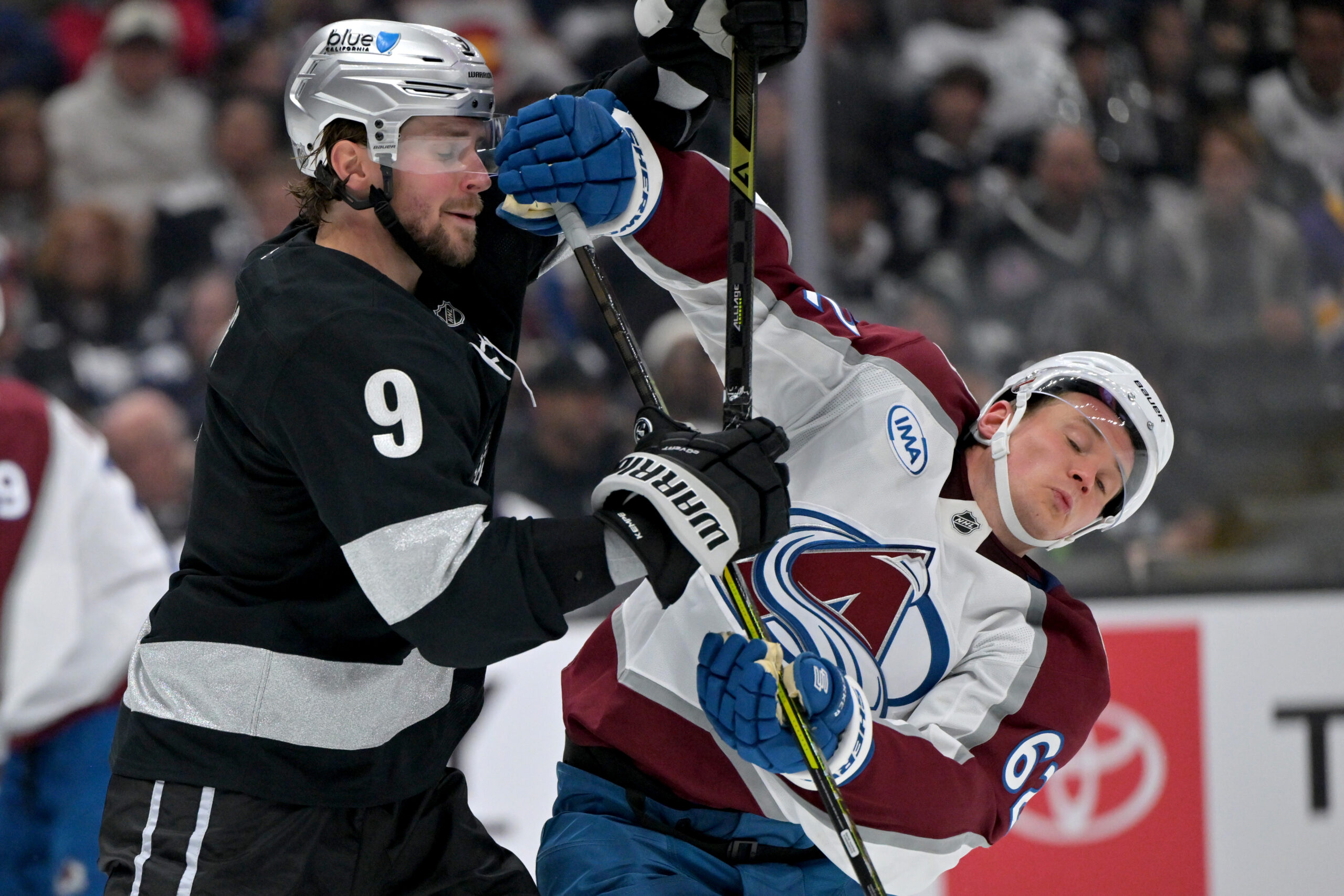 Oct 7, 2025; Los Angeles, California, USA; Los Angeles Kings right wing Adrian Kempe (9) and Colorado Avalanche left wing Artturi Lehkonen (62) battle for position on the ice during the third period at Crypto.com Arena. Mandatory Credit: Jayne Kamin-Oncea-Imagn Images