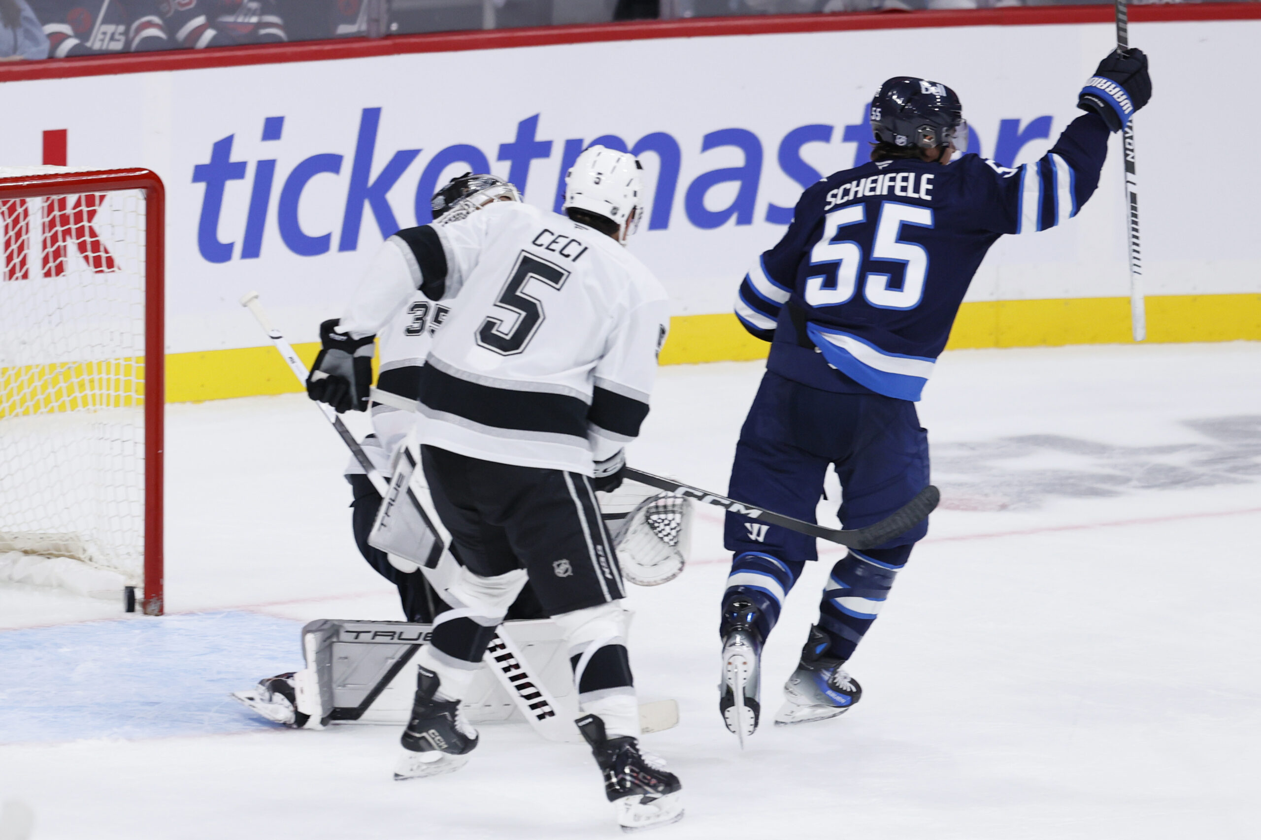Oct 11, 2025; Winnipeg, Manitoba, CAN; Winnipeg Jets center Mark Scheifele (55) celebrates his goal on Los Angeles Kings goaltender Darcy Kuemper (35) in the third period at Canada Life Centre. Mandatory Credit: James Carey Lauder-Imagn Images