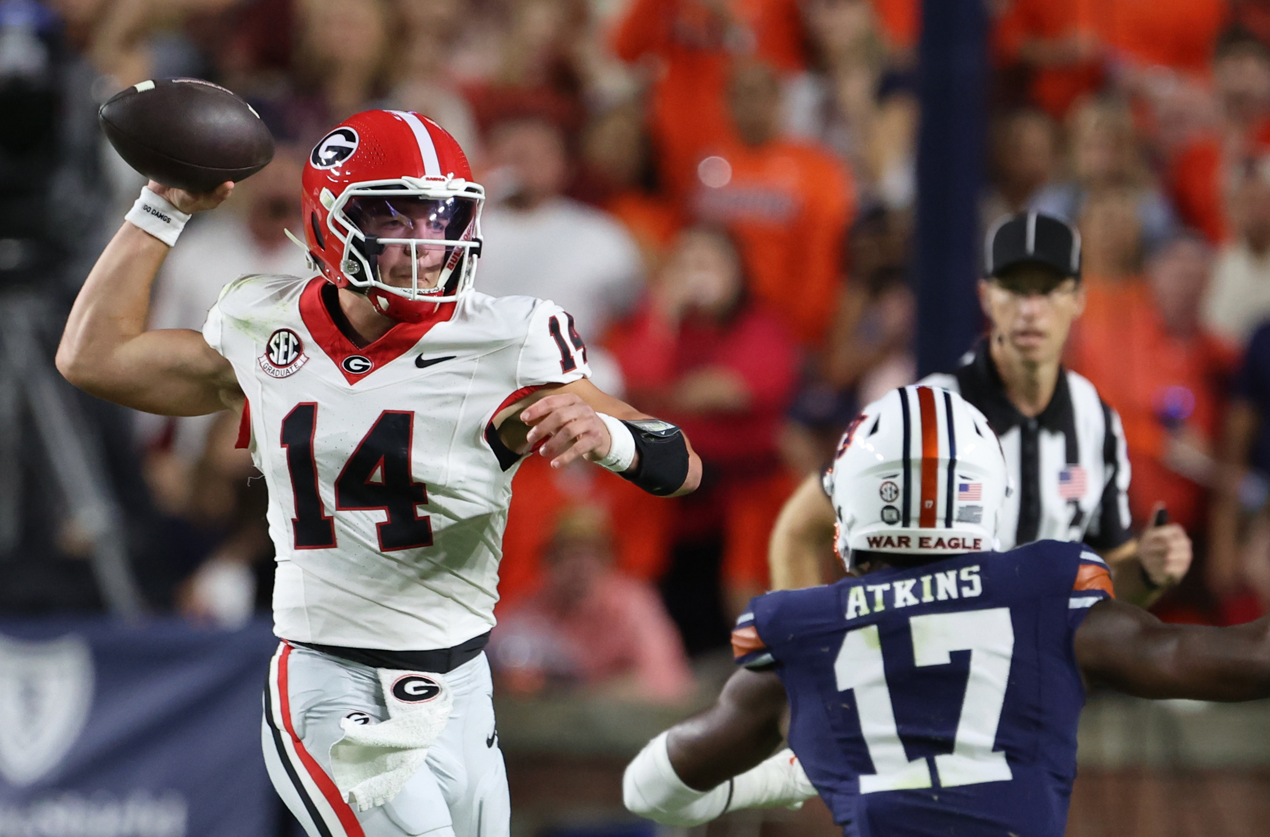 Oct 11, 2025; Auburn, Alabama, USA; Georgia Bulldogs quarterback Gunner Stockton (14) looks for a receiver during the first quarter against the Auburn Tigers at Jordan-Hare Stadium. Mandatory Credit: John Reed-Imagn Images