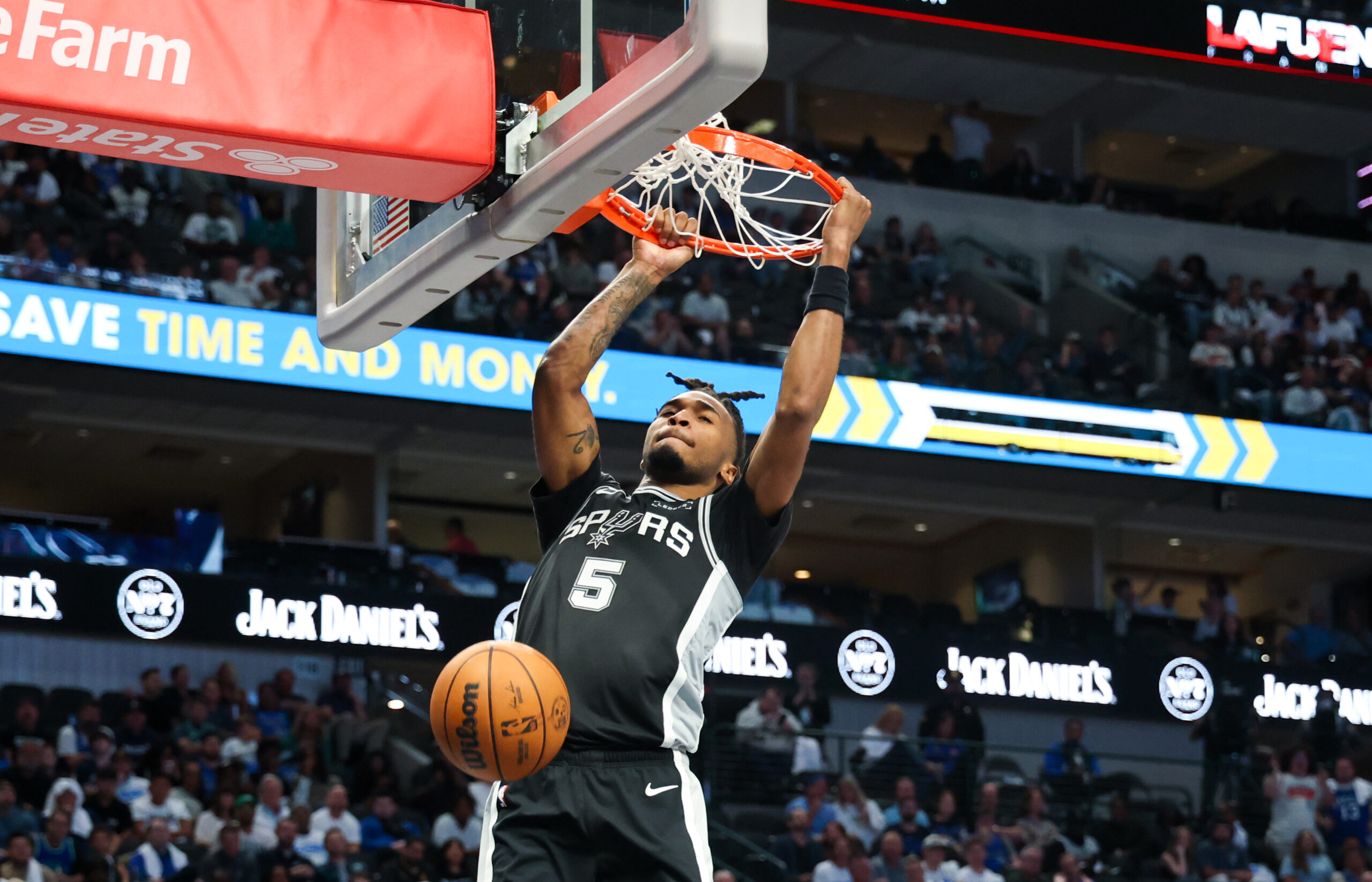 Oct 22, 2025; Dallas, Texas, USA; San Antonio Spurs guard Stephon Castle (5) dunks against the Dallas Mavericks during the second half at American Airlines Center. Mandatory Credit: Kevin Jairaj-Imagn Images