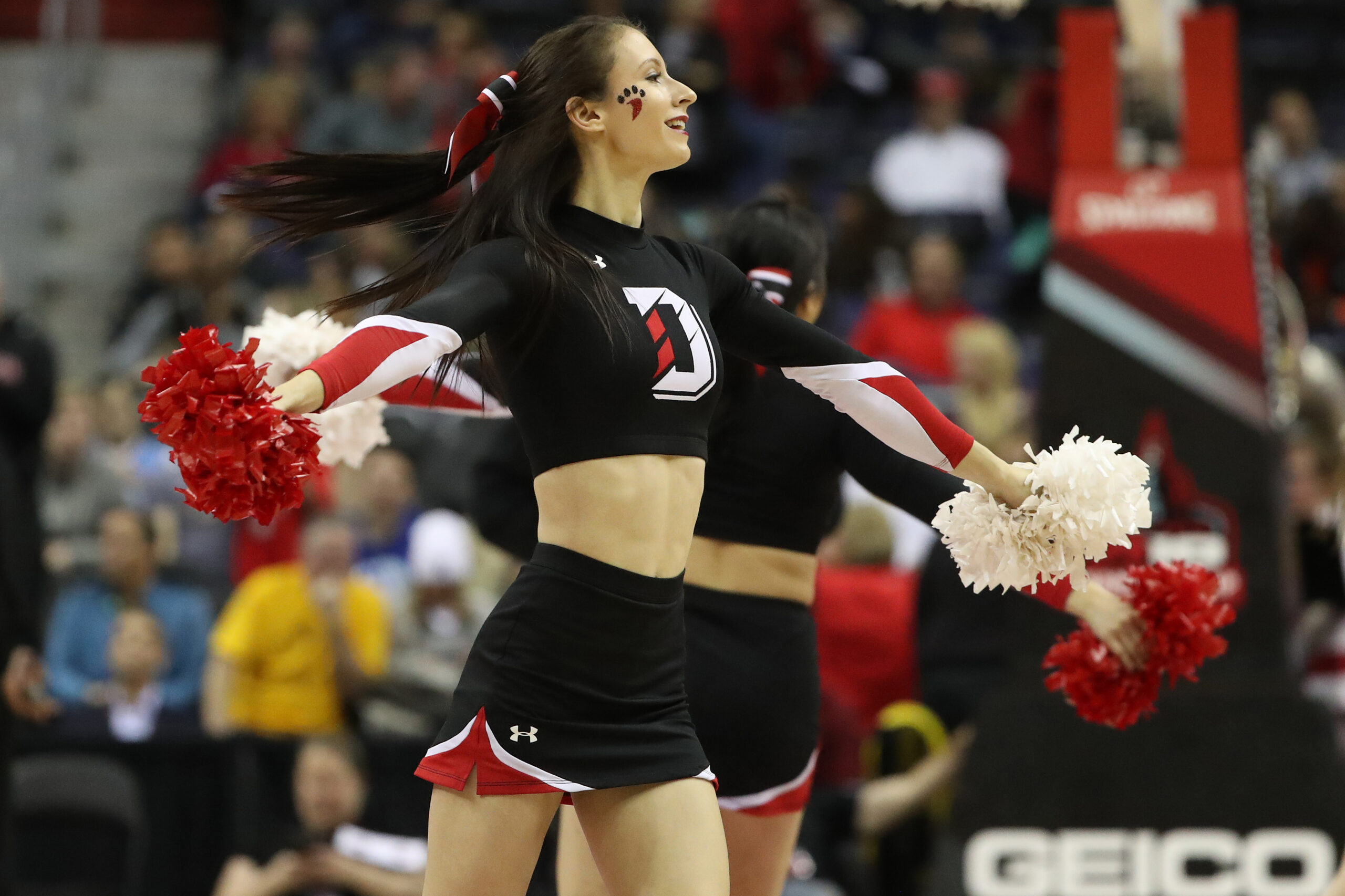 Mar 10, 2018; Washington, DC, USA; A Davidson Wildcats cheerleader dances on the court during a timeout against the St. Bonaventure Bonnies in the second half of an Atlantic 10 conference tournament semifinal at Capital One Arena. The Wildcats won 82-70. Mandatory Credit: Geoff Burke-Imagn Images